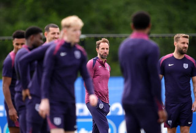 <p>England manager Gareth Southgate stands amid players at a training session
 (Adam Davy/PA)</p>