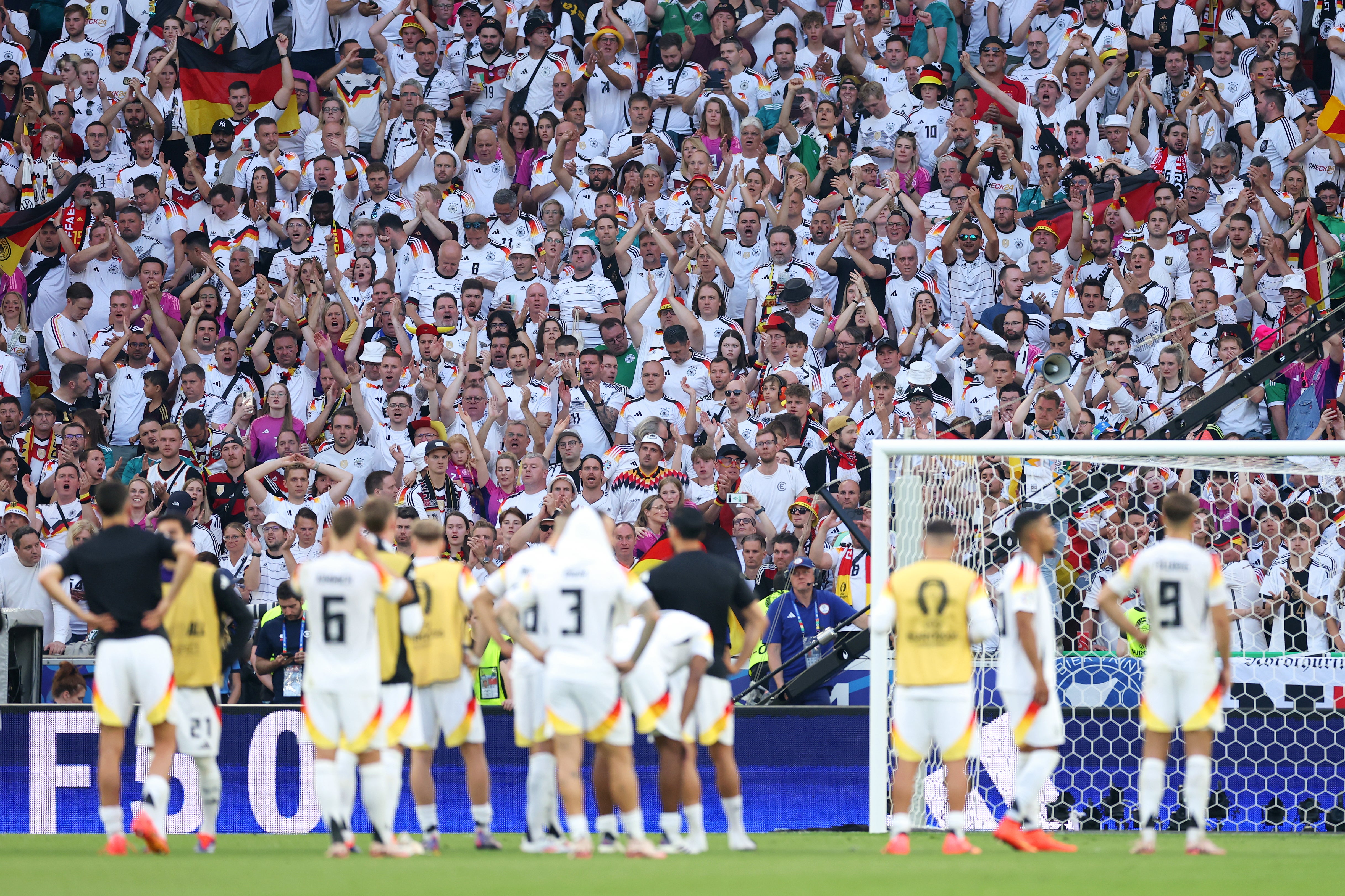 Germany fans applaud the team after their exit in Stuttgart