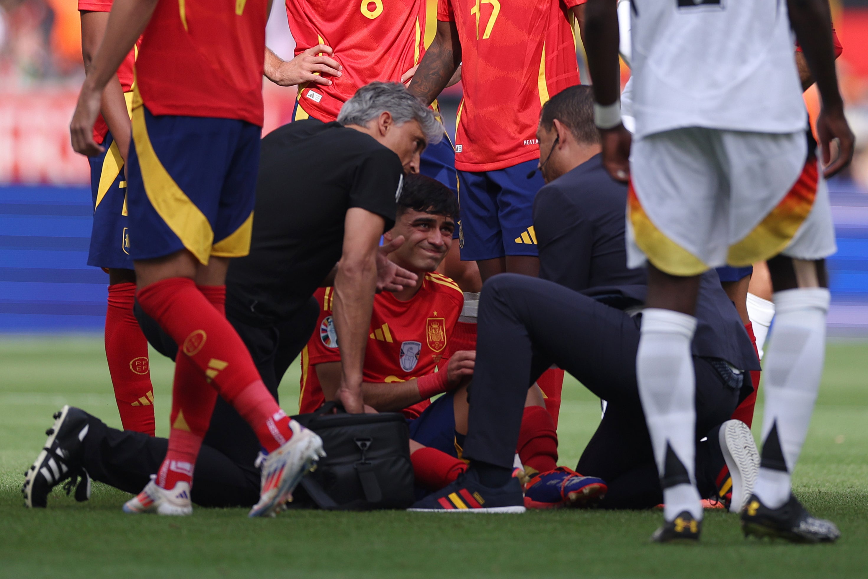 Pedri after a challenge by Toni Kroos early in the game