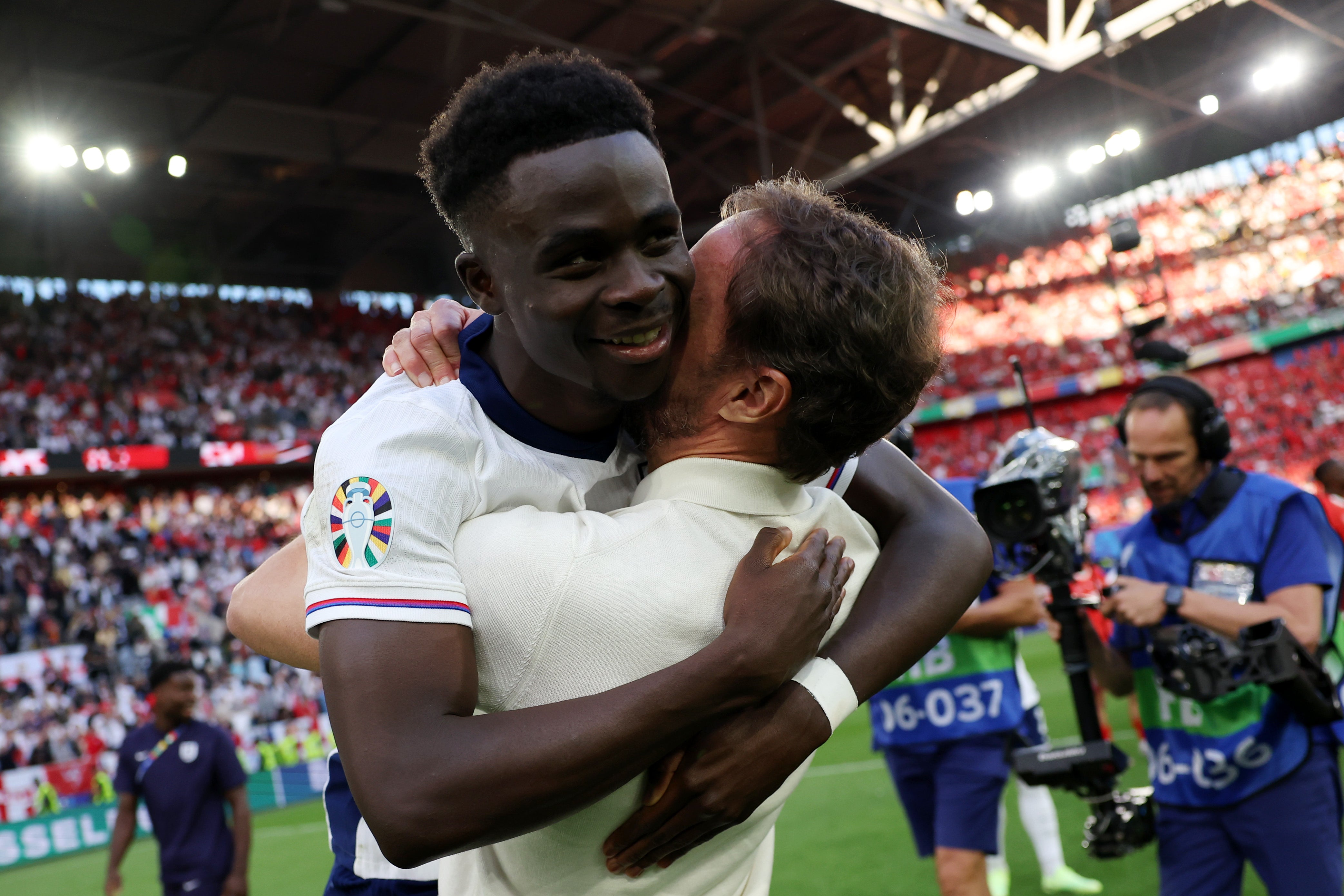 England coach Gareth Southgate shows his affection for Saka