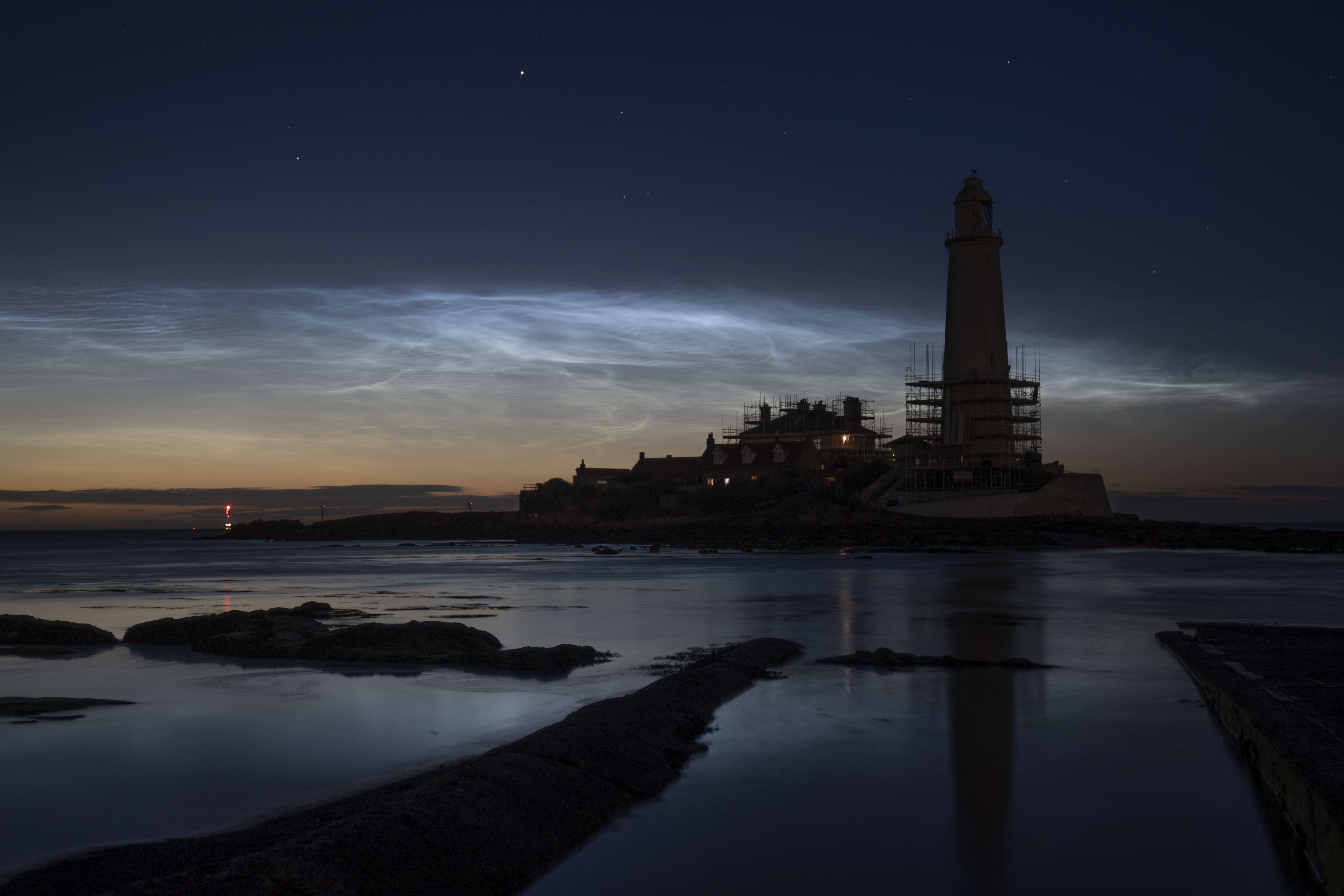 Noctilucent clouds or night clouds over St Mary’s Lighthouse in Whitley Bay, North Tyneside (Owen Humphreys/PA)
