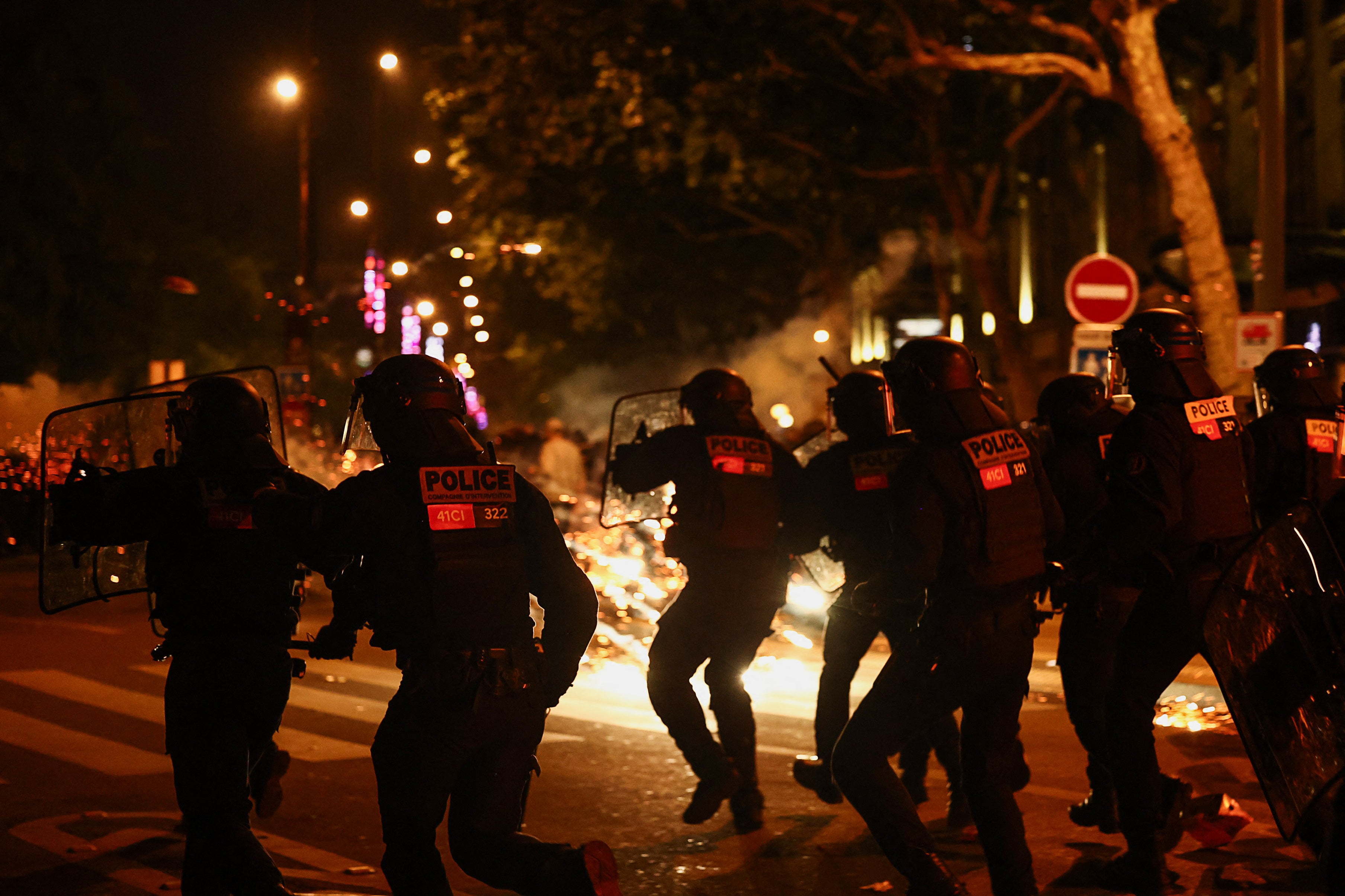 French riot police run during clashes with demonstrators following partial results in the second round of the early French parliamentary elections, at the Place de la Republique in Paris, France, 7 July 2024