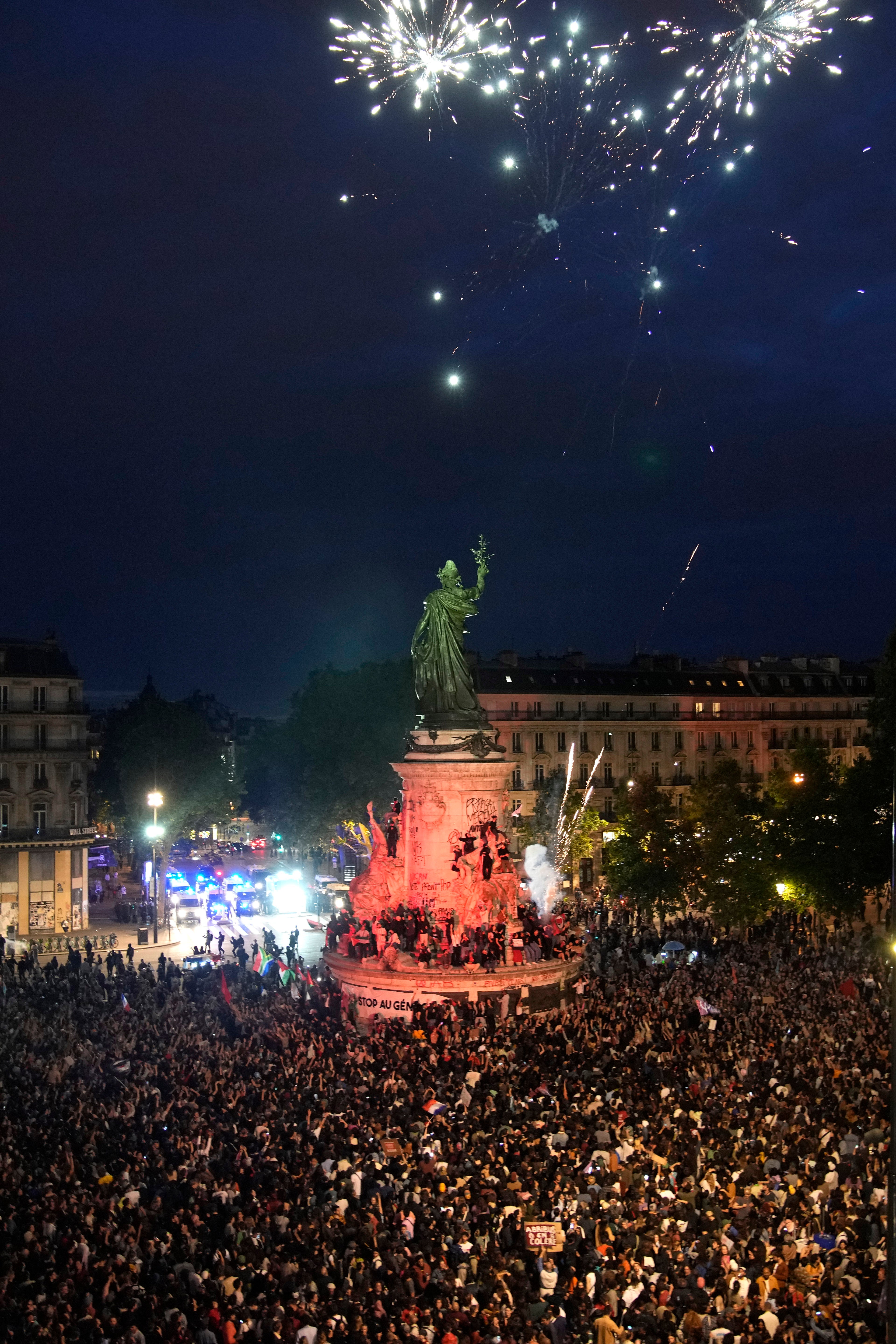 Fireworks go off in Republique Plaza after the exit poll results