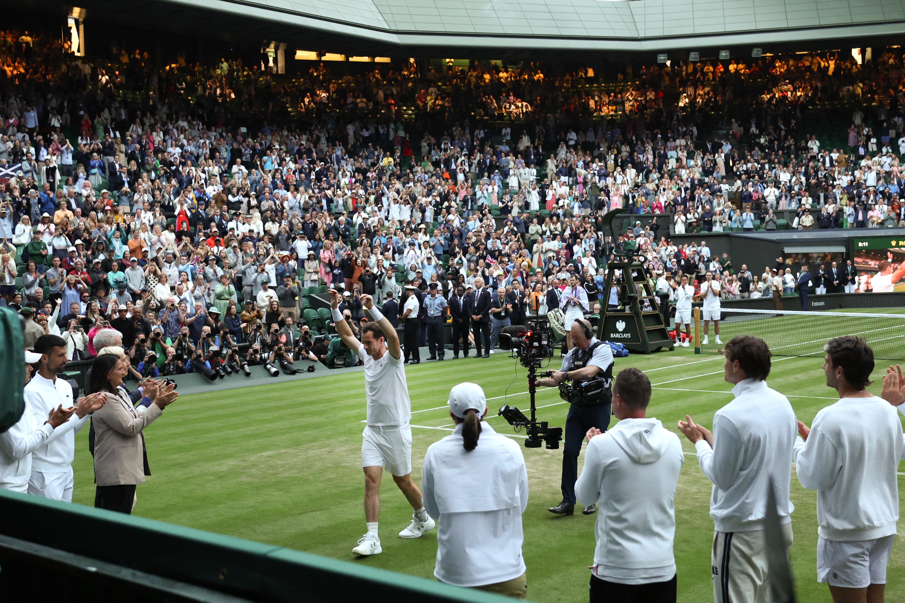 Murray departs Centre Court after defeat in the doubles