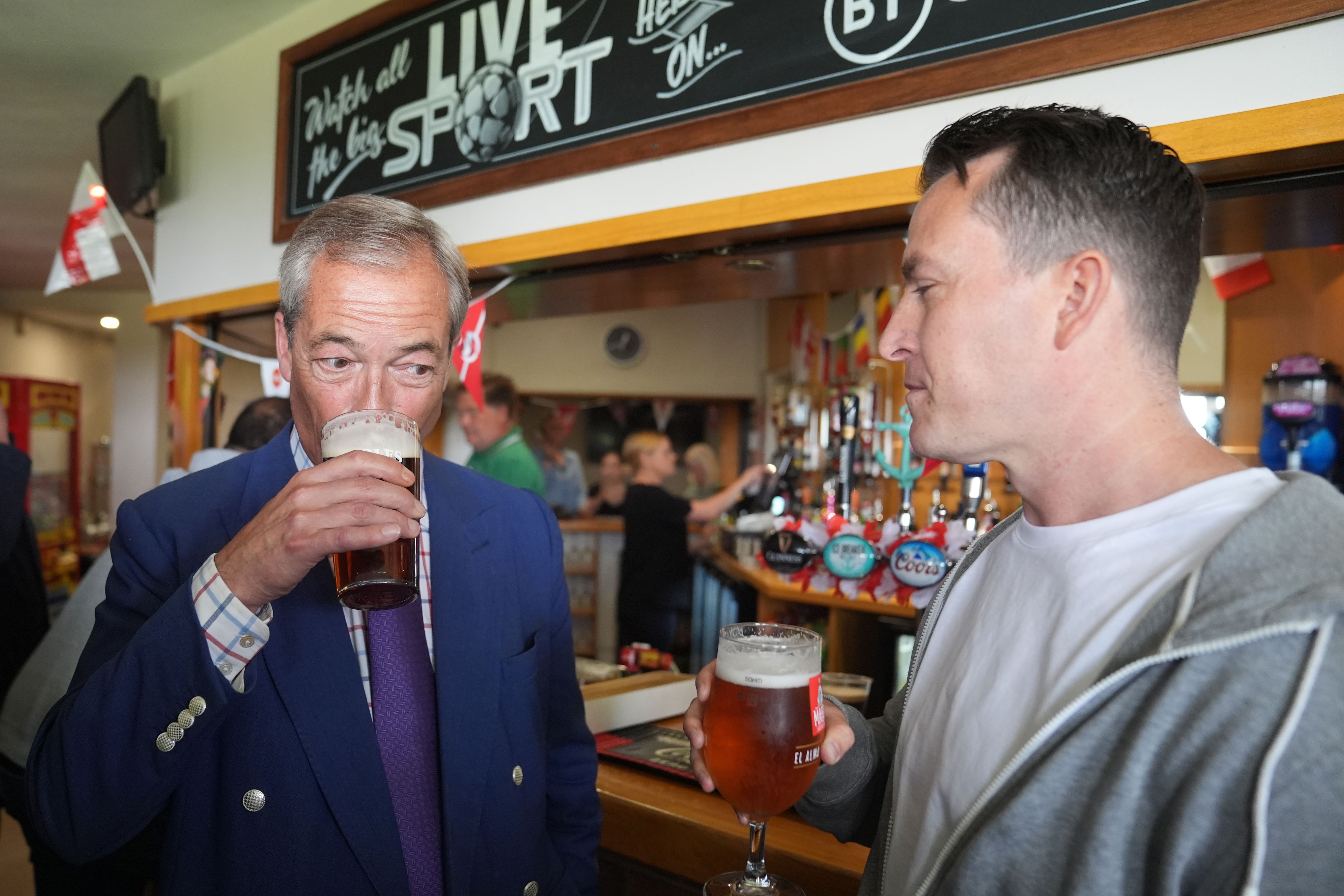 Reform UK leader Nigel Farage (left) and new Reform MP for South Basildon and East Thurrock, James McMurdock (right), during a visit to Wyldecrest Sports Country Club, Corringham, Essex (Joe Giddens/PA)