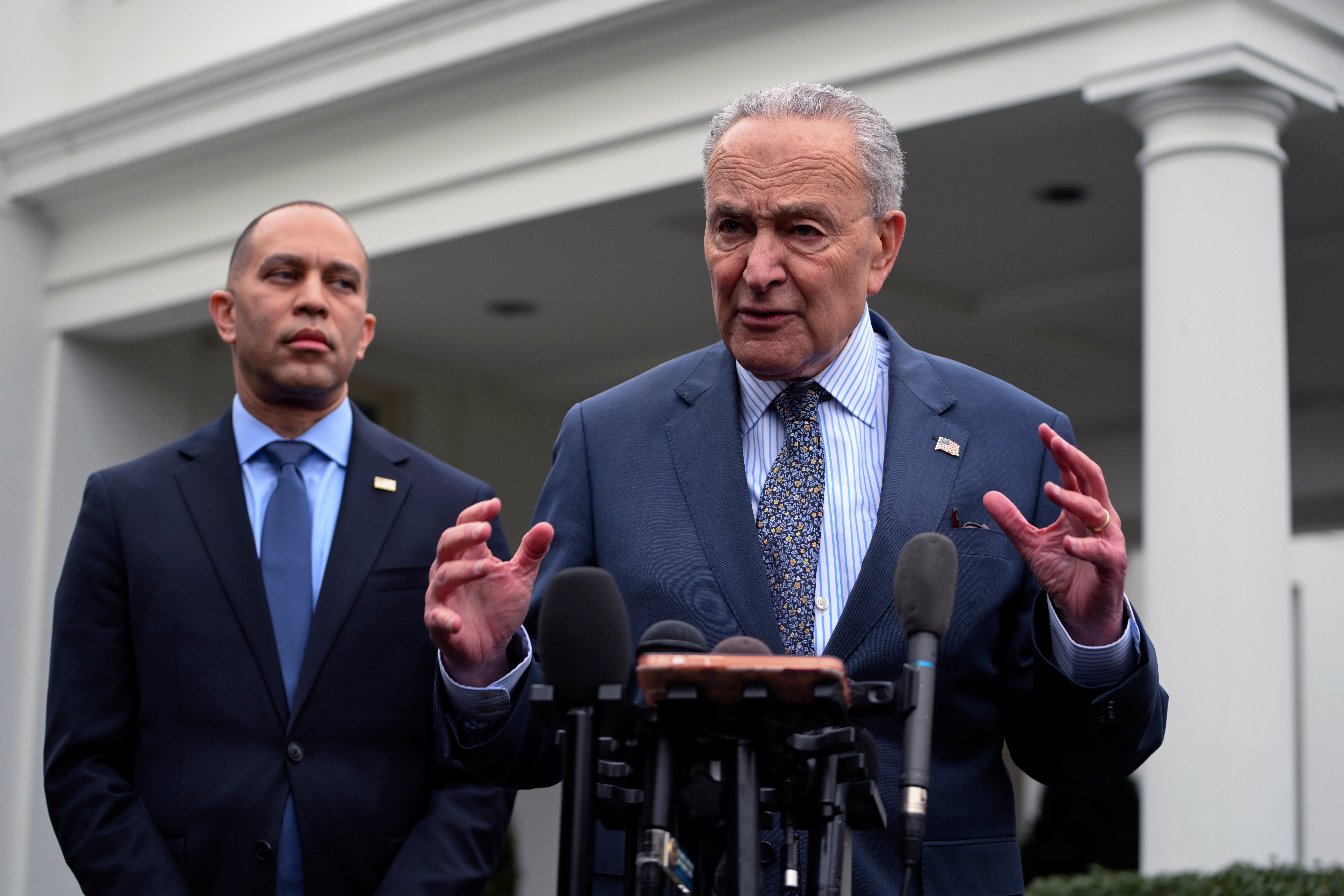 Senate Democratic leader Chuck Schumer speaks at a news conference as House Minority Leader Hakeem Jeffries, the highest-ranking House Democrat, looks on.