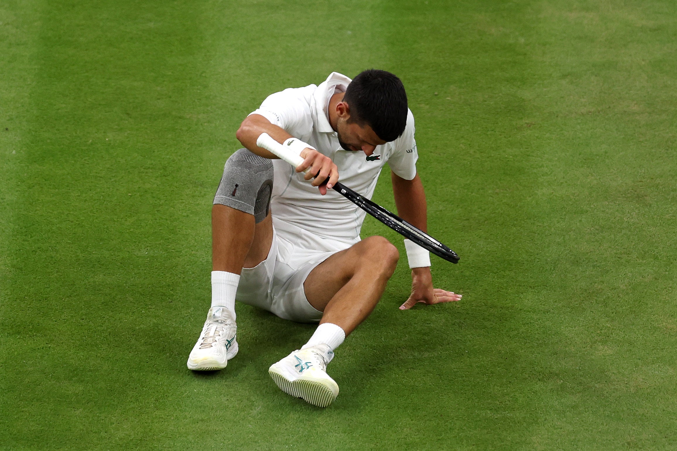 Djokovic had to get up off the lawn numerous times in his fourth-round match