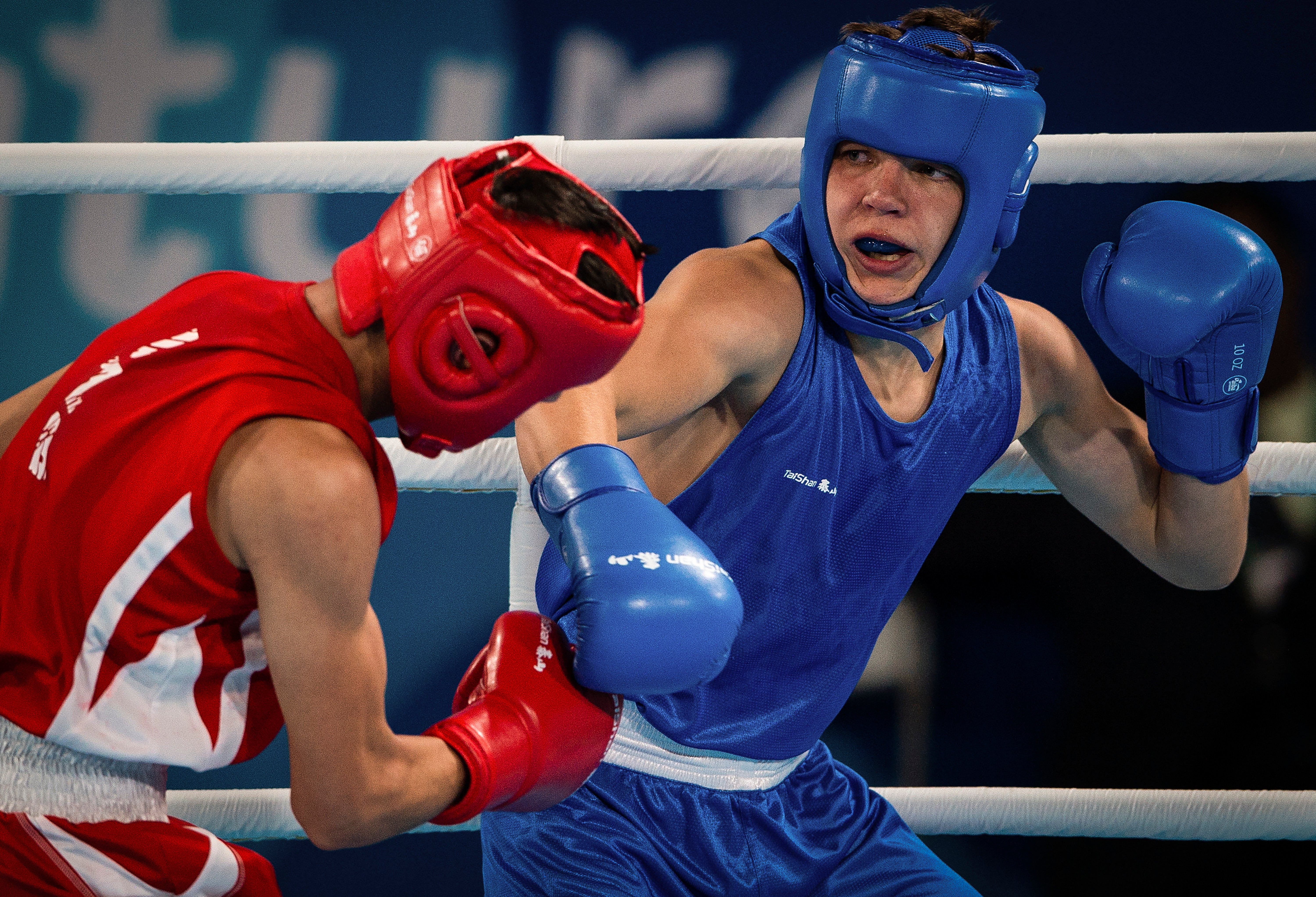 Maksym Halinichev of Ukraine, right, competes against Abdumalik Khalokov of Uzbekistan in the Boxing Men's Bantam (56kg) Gold Medal Bout at the Oceania Pavilion of Youth Olympic Park during the Youth Olympic Games in Buenos Aires