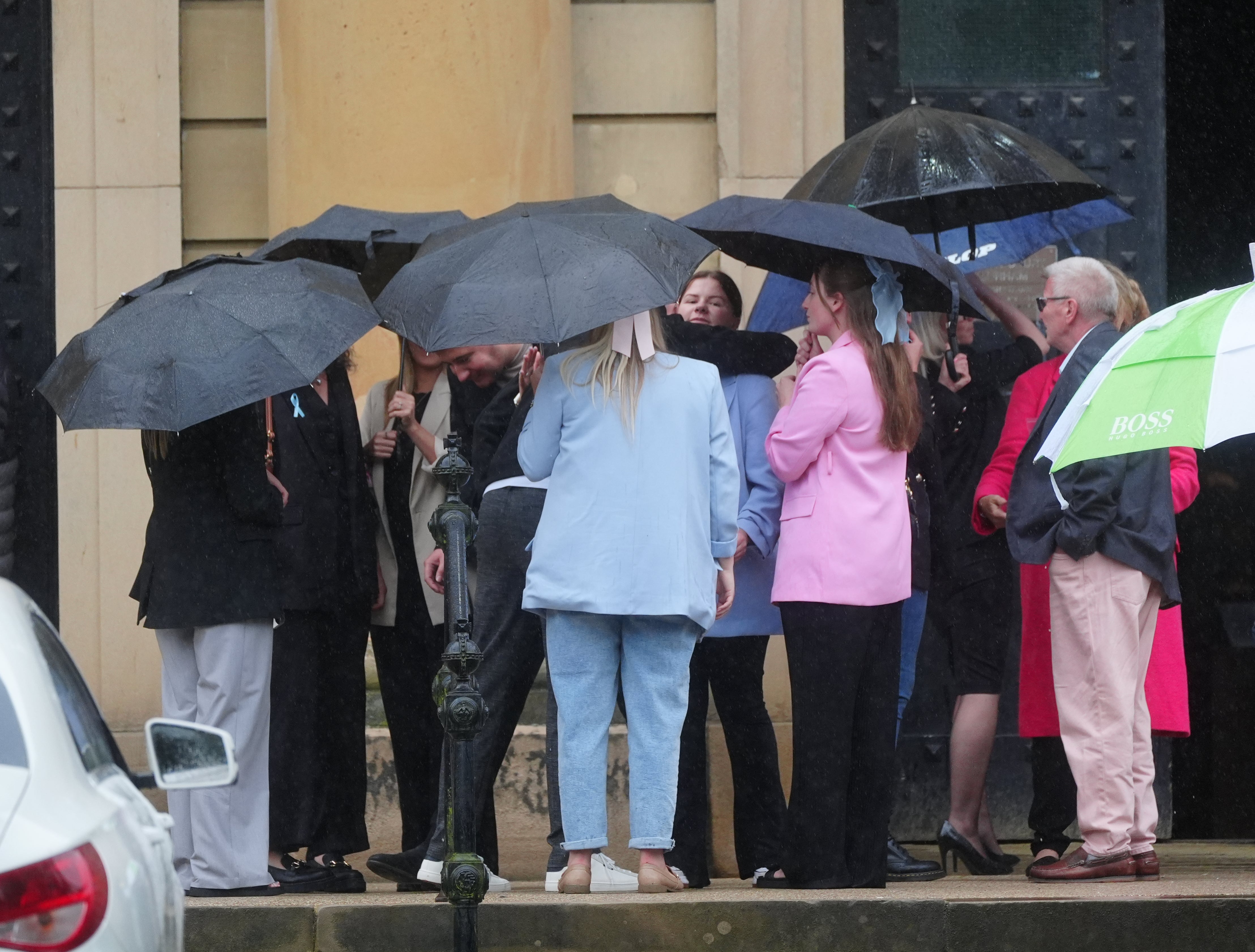 Sharlona Warner is embraced by a supporter outside Durham Crown Court after Darryl Anderson was sentenced