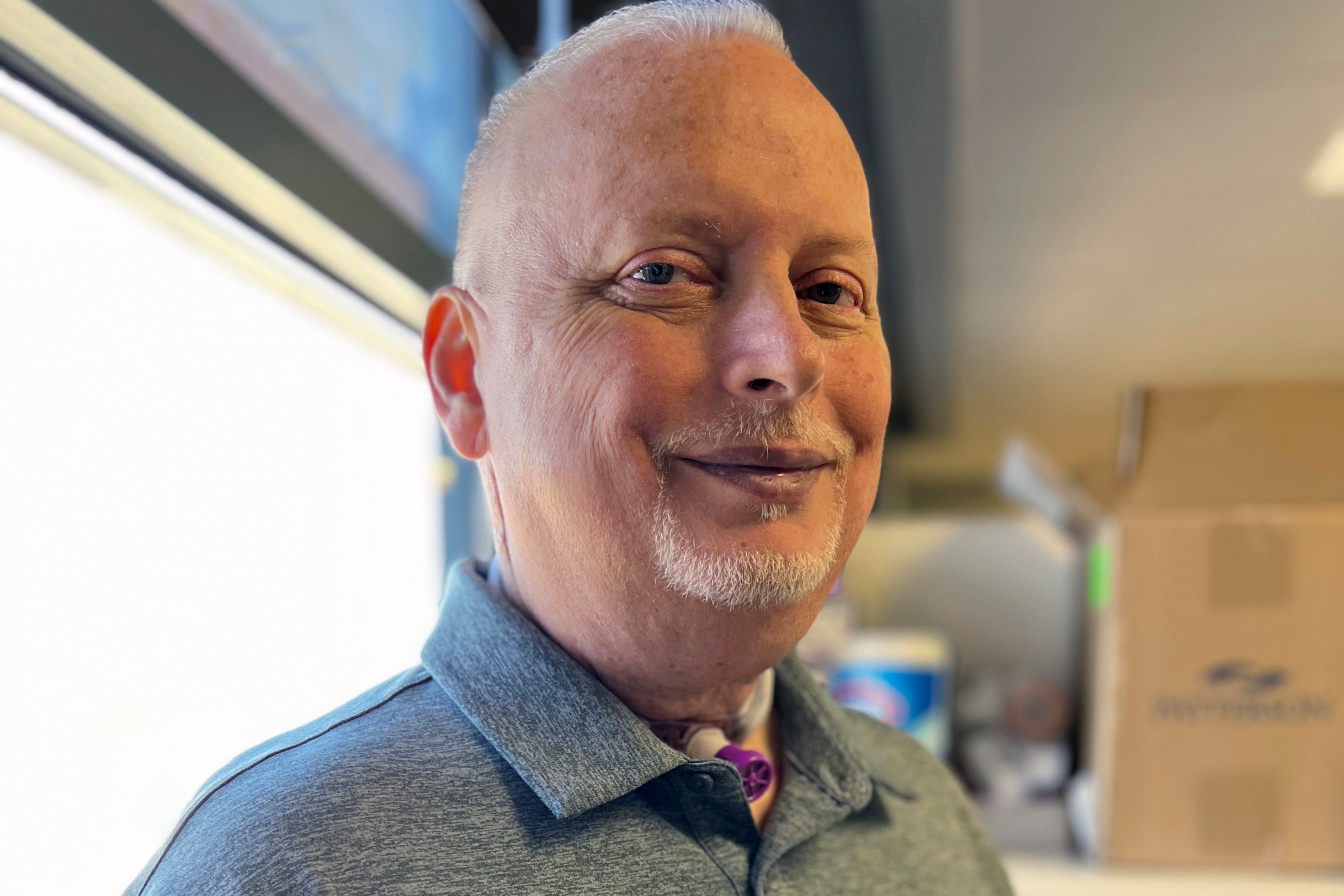 Marty Kedian poses for a photo in Mayo Clinic’s Head and Neck Regenerative Medicine Laboratory in Scottsdale