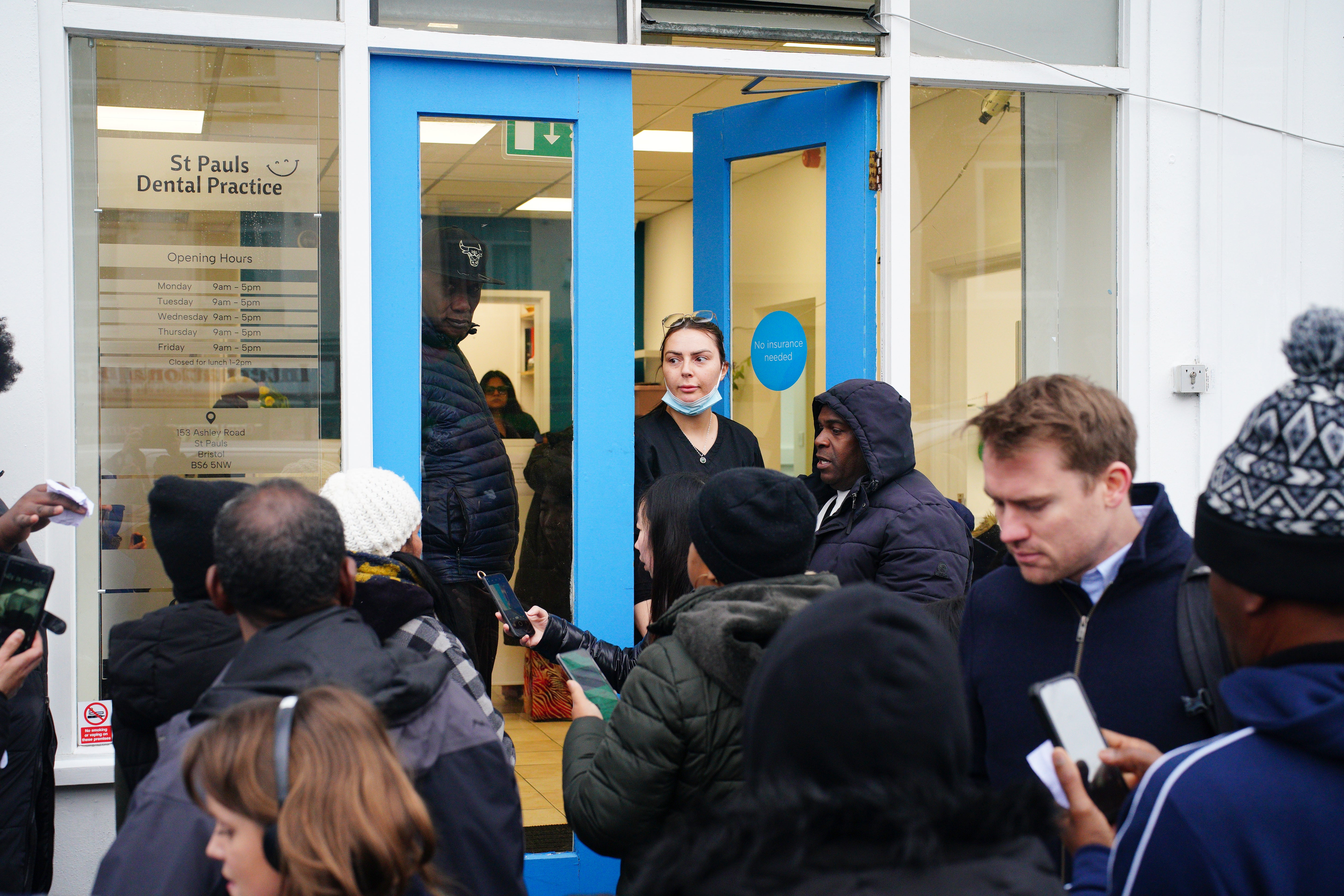 Huge queues of people waiting outside St Paul’s Dental Practice in Bristol (Ben Birchall/ PA)