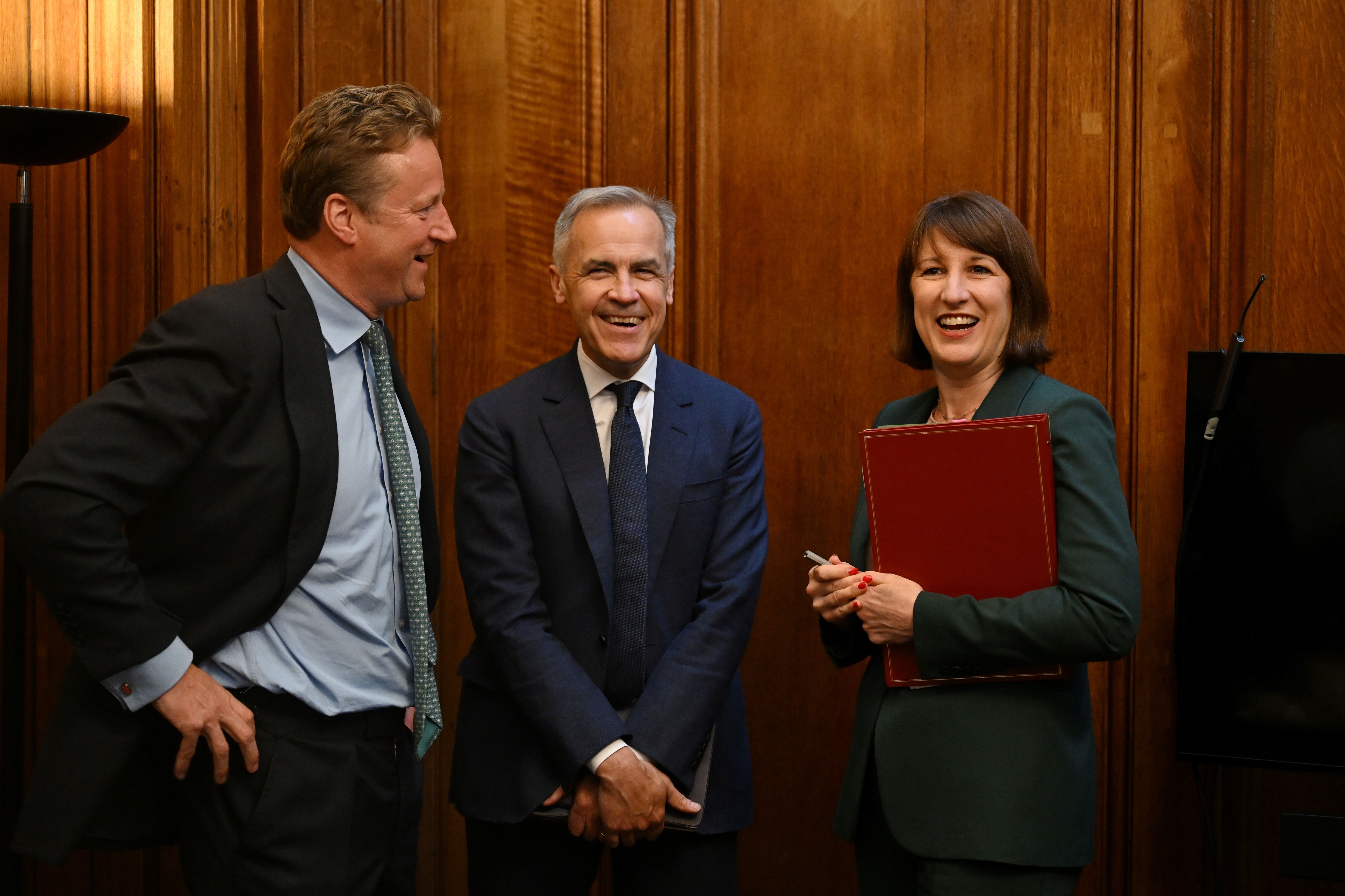 Chancellor of the Exchequer Rachel Reeves with Former governor of the Bank of England Mark Carney (centre)at the announcement of the establishment of the National Wealth Fund (Justin Tallis/PA)