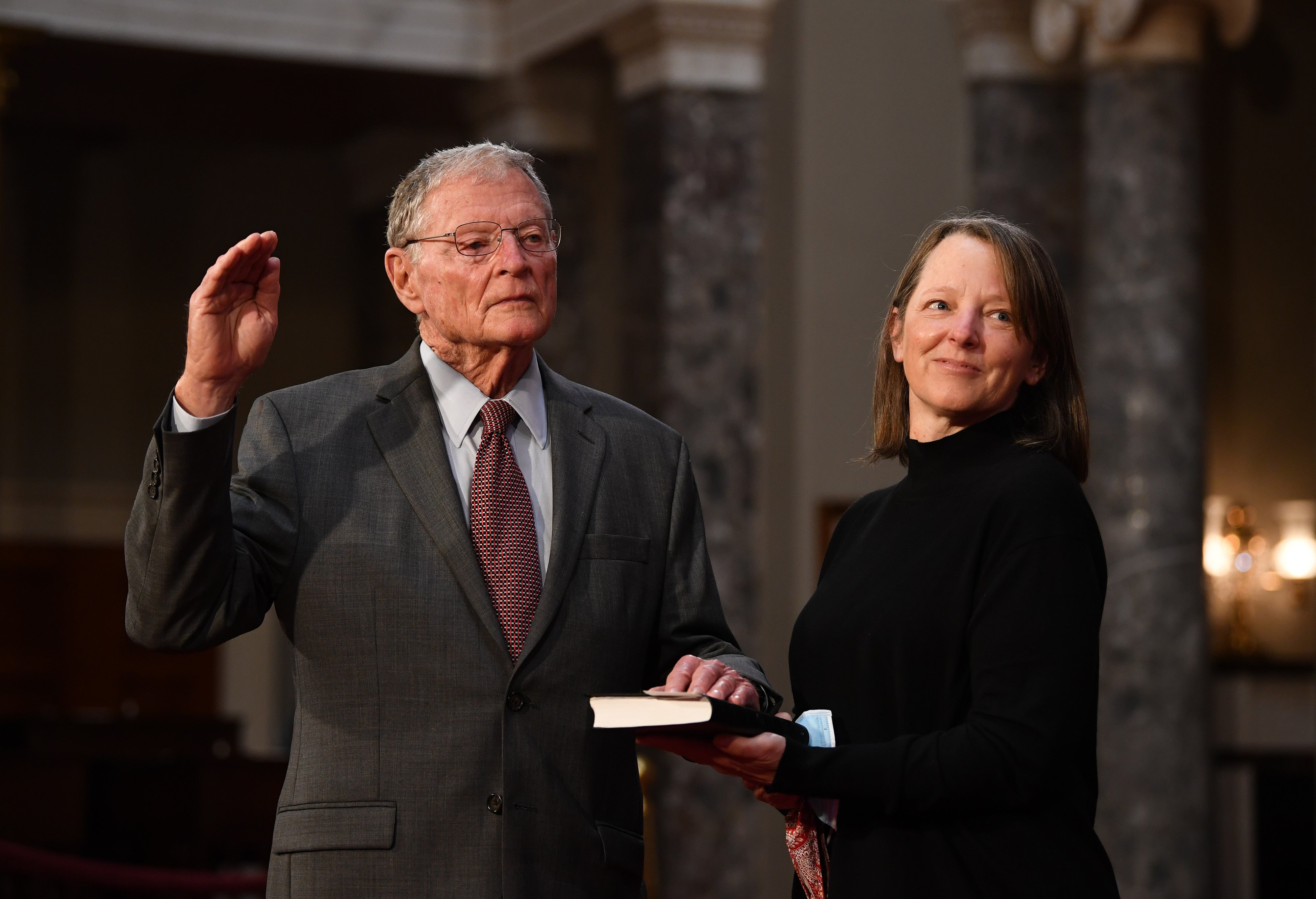 Senator Jim Inhofe participates in a mock swearing-in for the 117th Congress with Vice President Mike Pence, as his wife Kay Inhofe holds a bible, in the Old Senate Chambers at the U.S. Capitol Building January 3, 2021 in Washington, DC