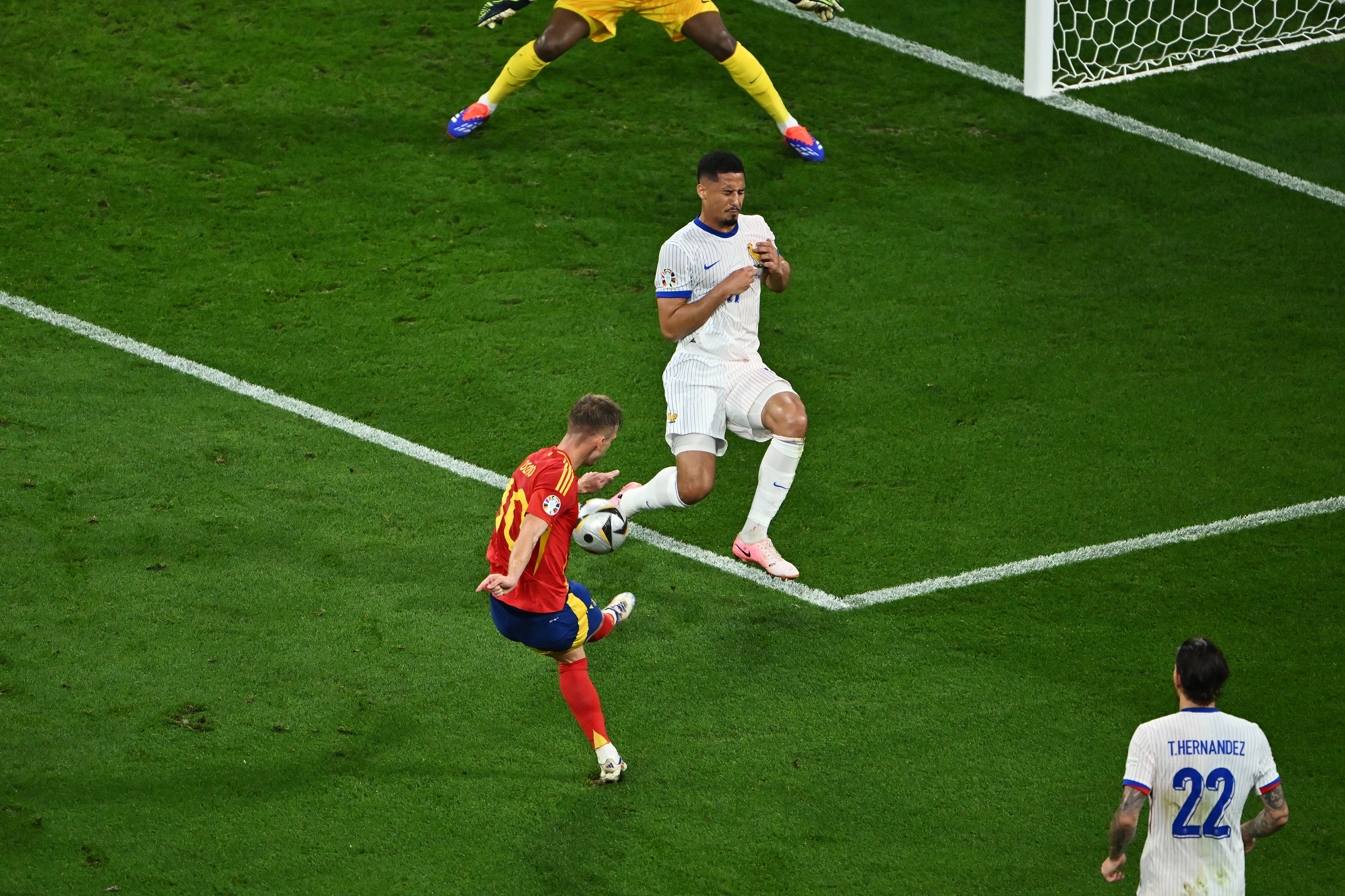 William Saliba is unable to block Olmo’s shot as Spain take the lead