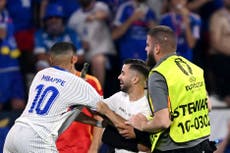 Pitch invader grabs Kylian Mbappe during Spain v France quarter-final at Euro 2024