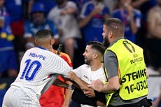Pitch invader grabs Kylian Mbappe during Spain v France quarter-final at Euro 2024