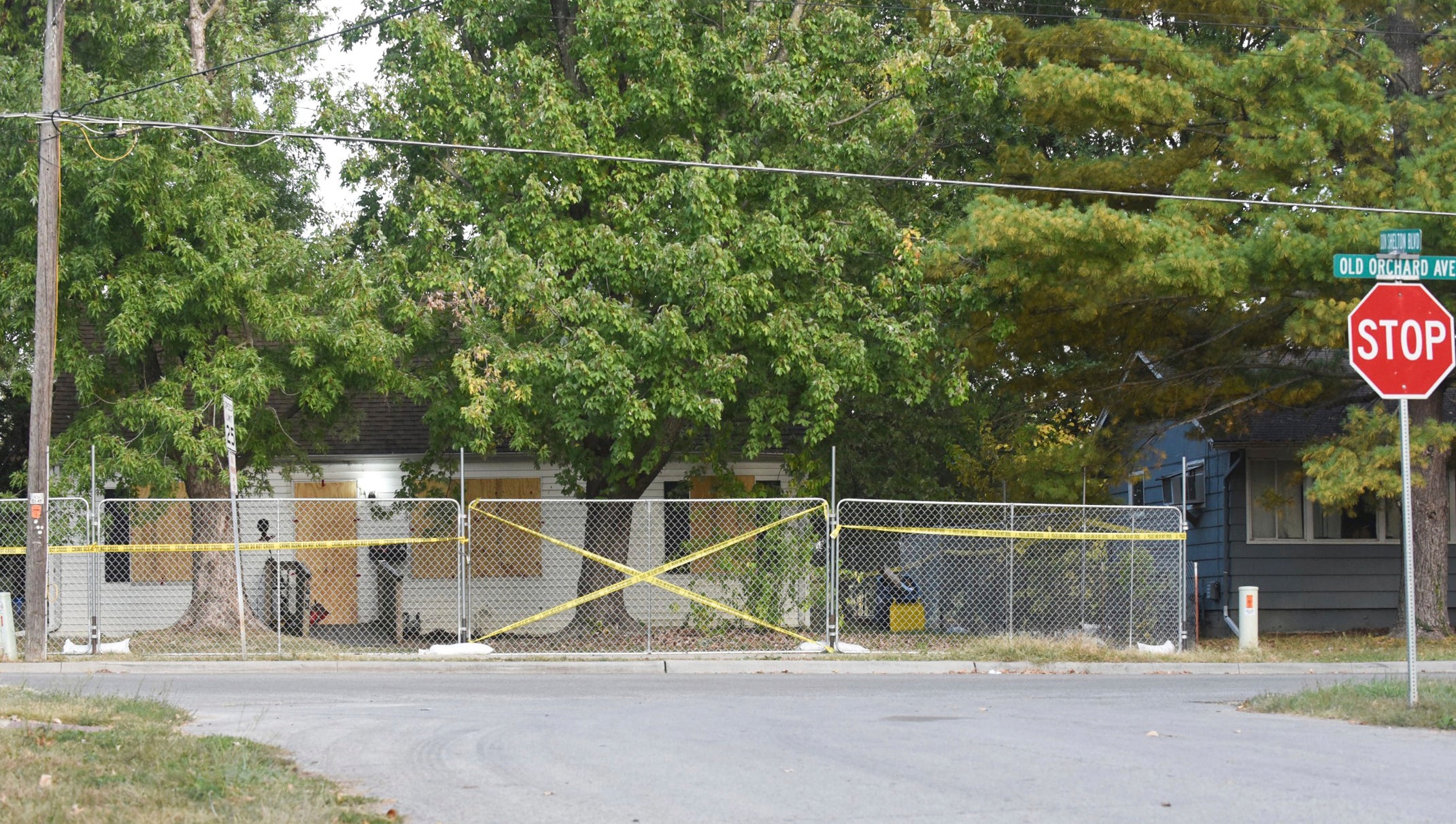 Police tape blocks the boarded-up residence of Timothy Haslett on October 10, 2022, in Excelsior Springs