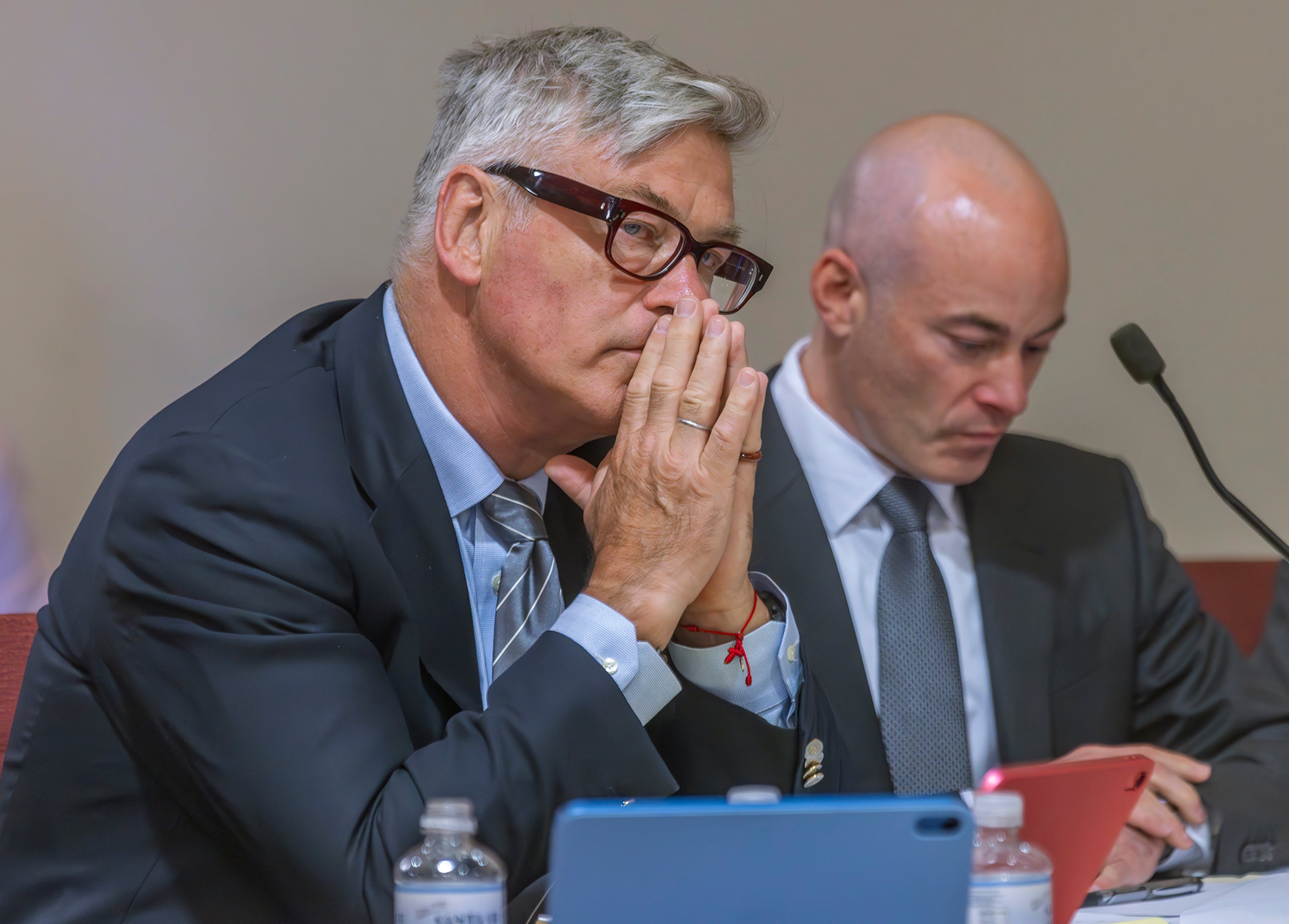 Actor Alec Baldwin, left, sits with his lawyer Luke Nikas, in District Court in Santa Fe