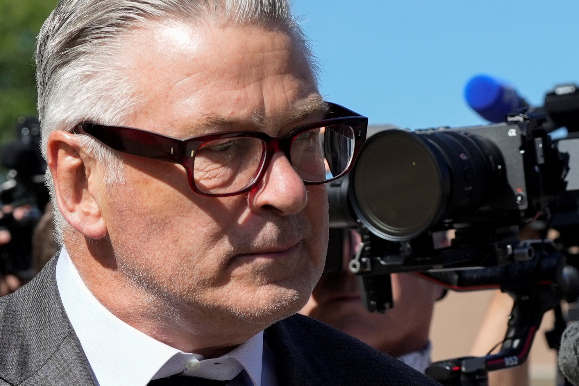 Alec Baldwin walks outside the courthouse, as jury selection begins