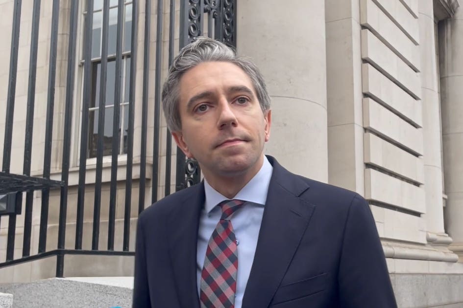 Taoiseach Simon Harris outside Government Buildings in Dublin (Grainne Ni Aodha/PA)