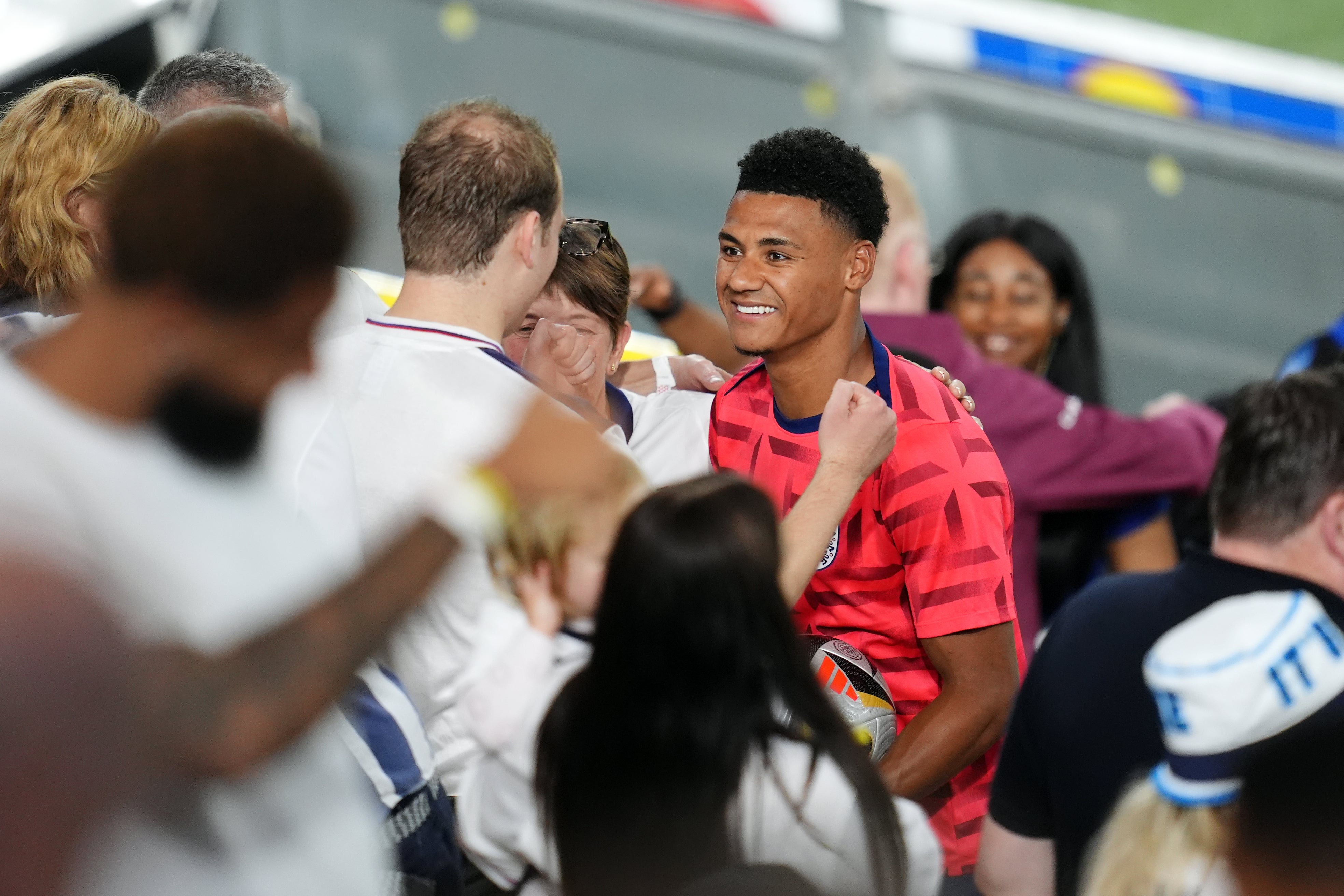 Watkins (centre) take photos with fans after the match (Adam Davy/PA)