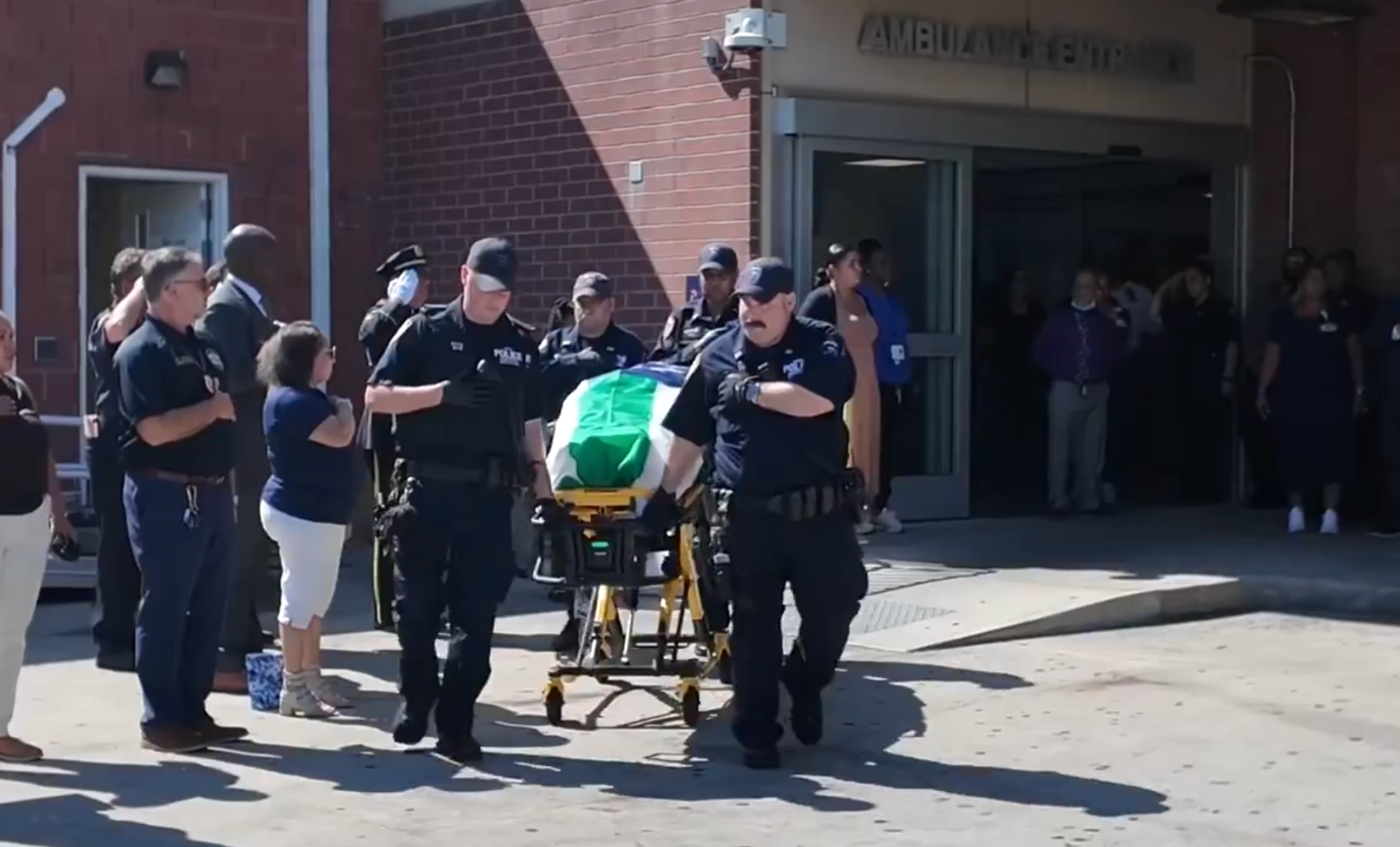 The body of NYPD recruit Edgar Ordonez is escorted by officers during a dignified transfer, following the 33-year-old’s death on Wednesday