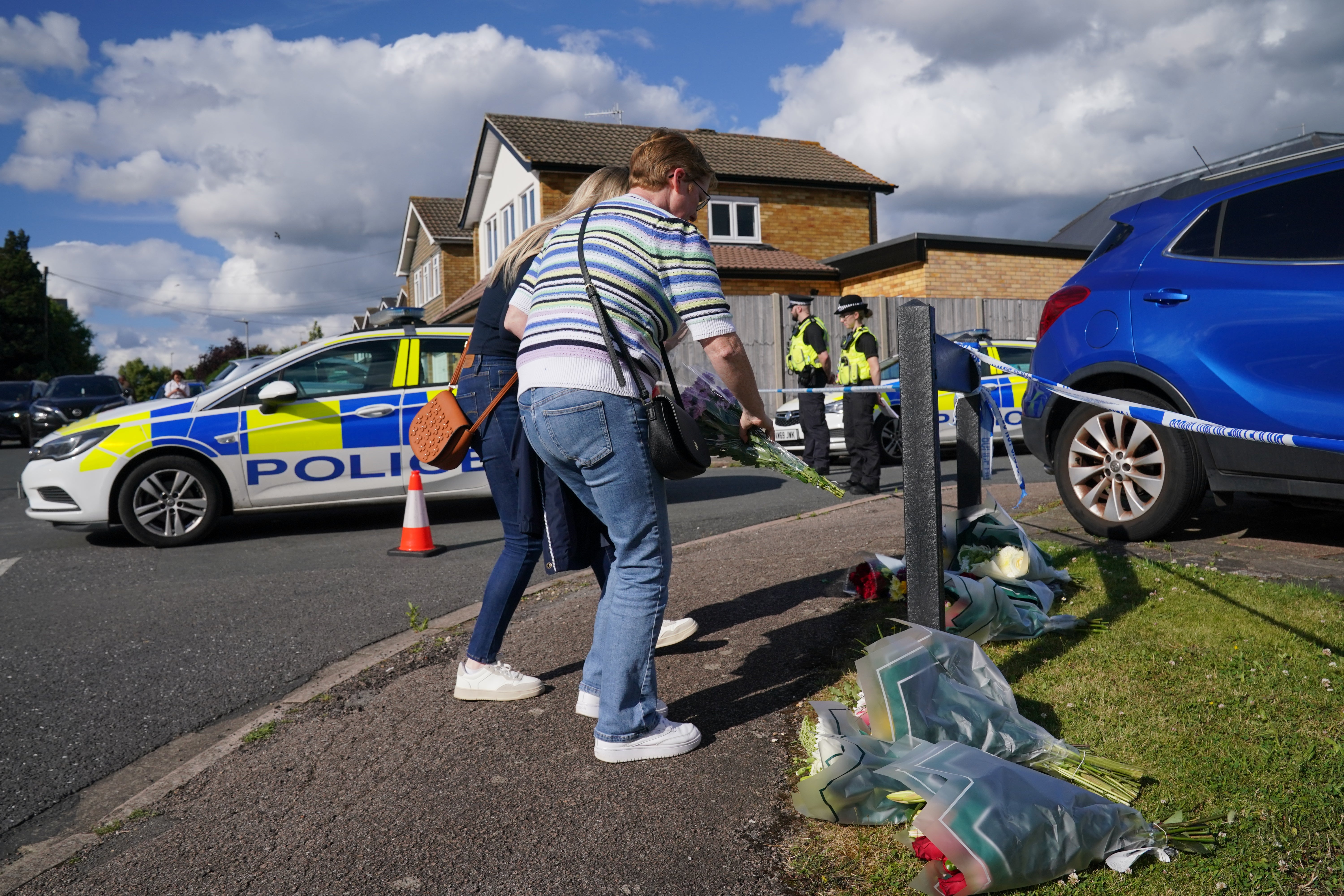 Floral tributes near the scene of the attack in Ashlyn Close, Bushey, Hertfordshire