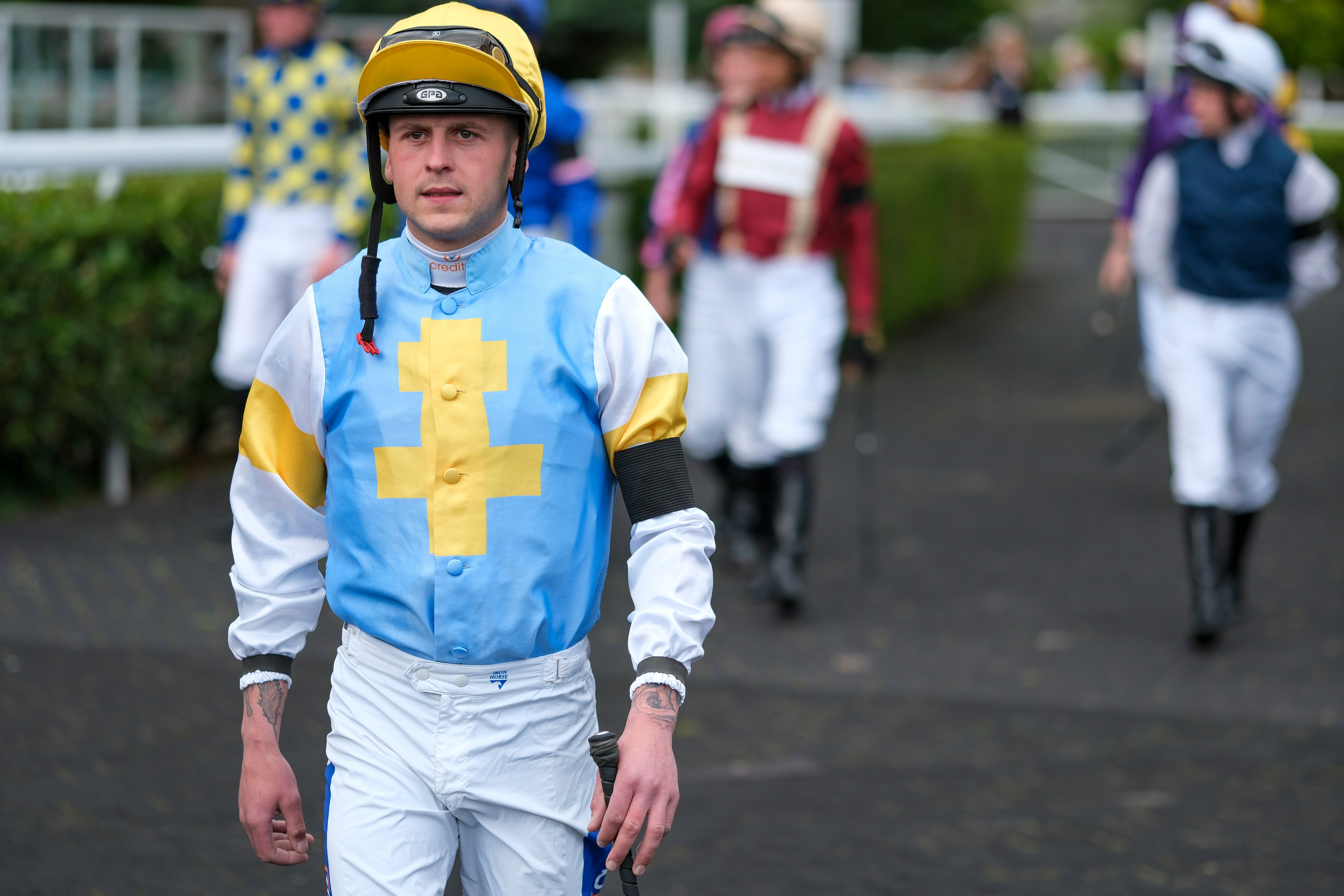 Jockeys wore black armbands in respect of BBC Racing radio commentator John Hunt