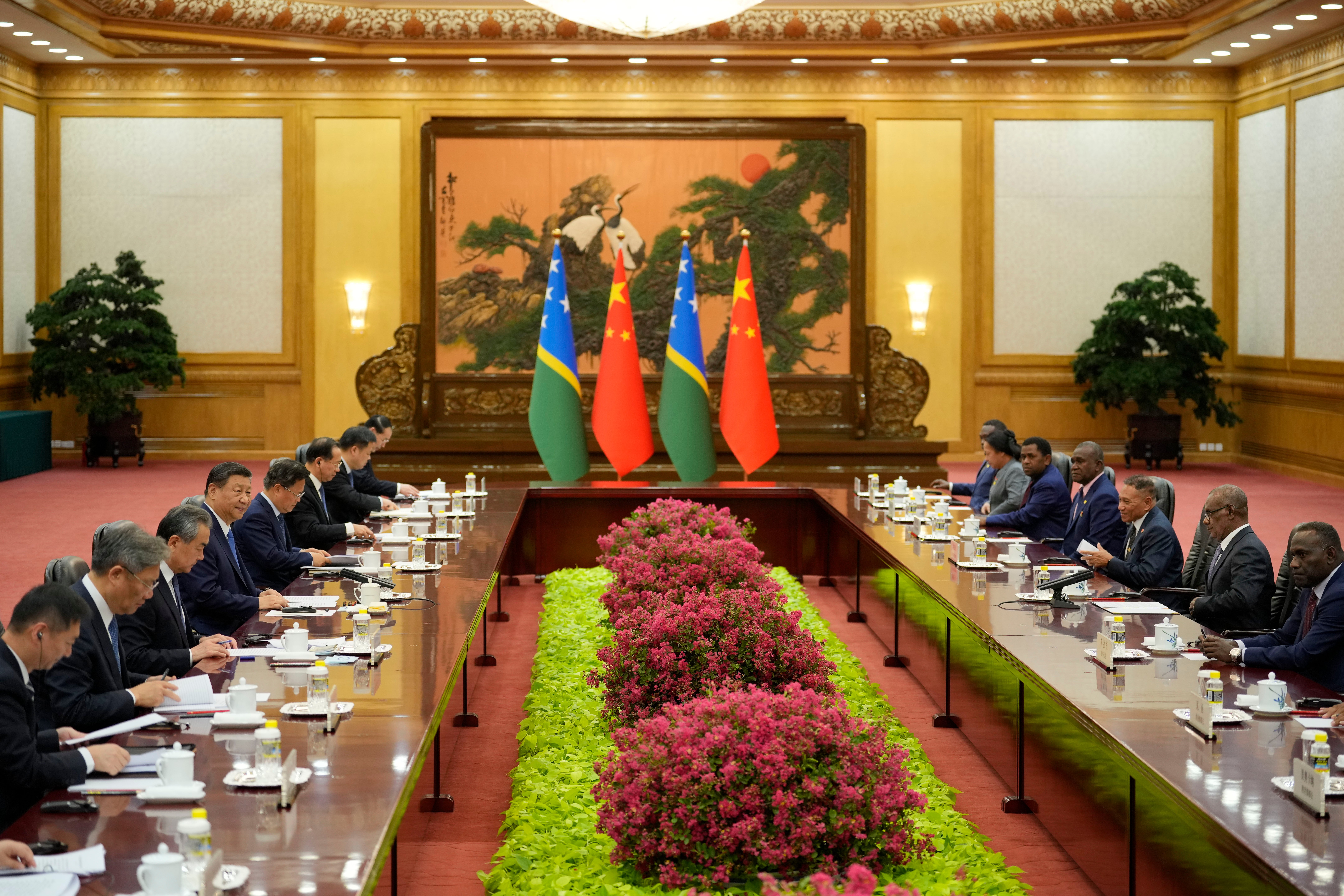 Solomon Islands Prime Minister Jeremiah Manele, second right, attends a meeting with Chinese President Xi Jinping, fourth left, at the Great Hall of the People in Beijing, China, Friday, July 12, 2024