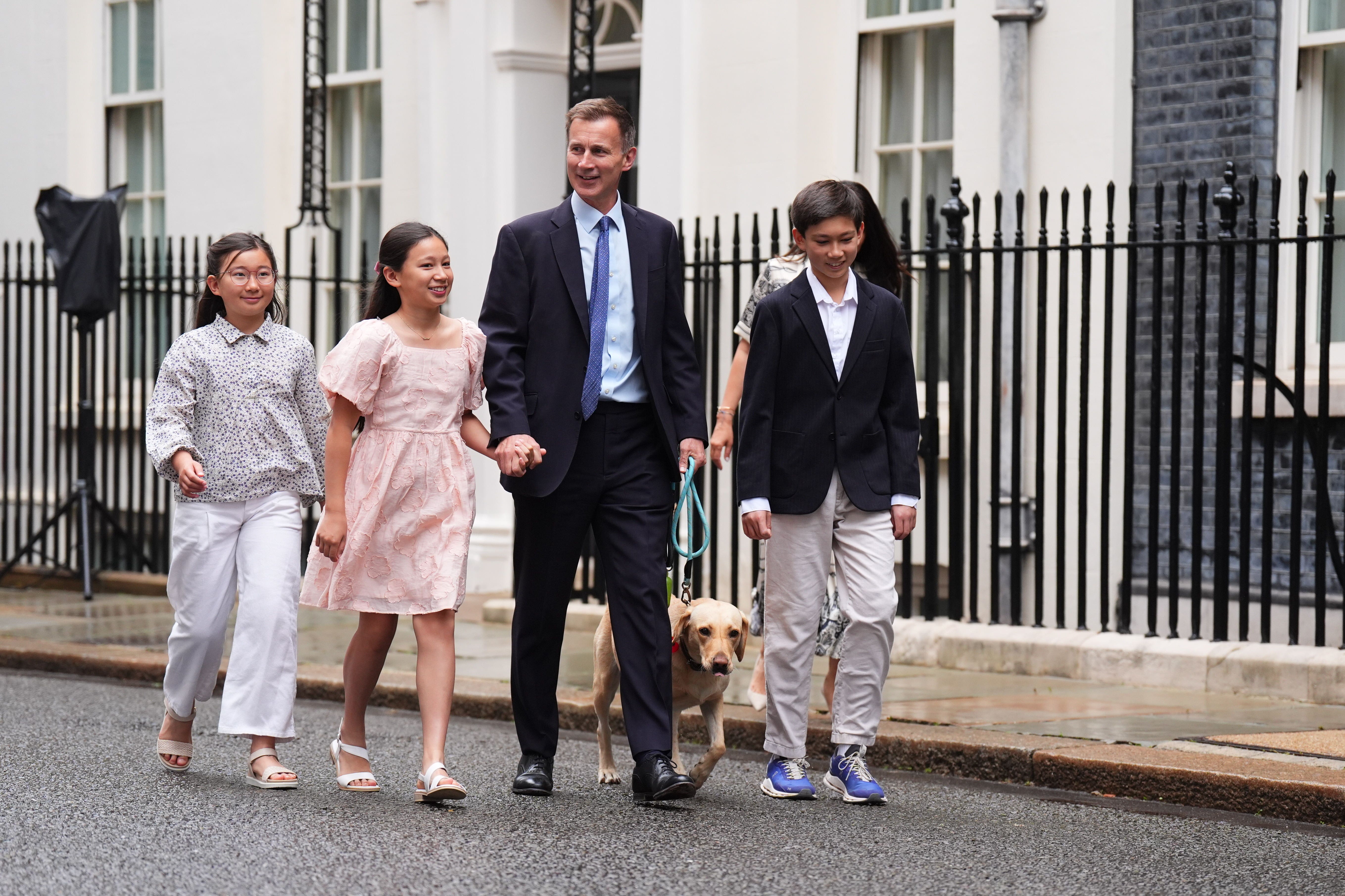 Outgoing Conservative chancellor Jeremy Hunt, with his wife Lucia Hunt and their children Jack, Anna and Eleanor, leaves 11 Downing Street (James Manning/PA)