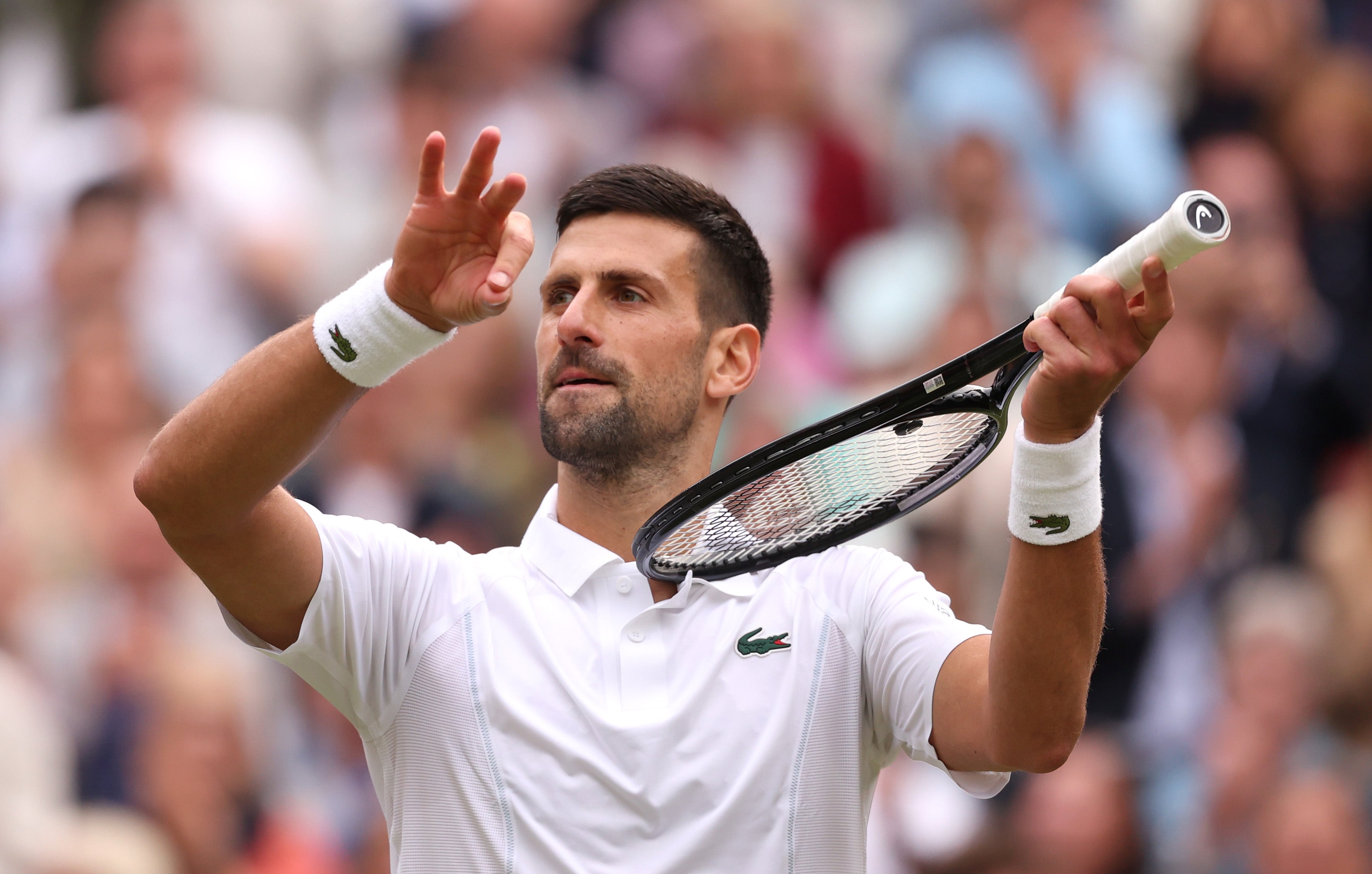 Novak Djokovic celebrates on match point after beating Lorenzo Musetti