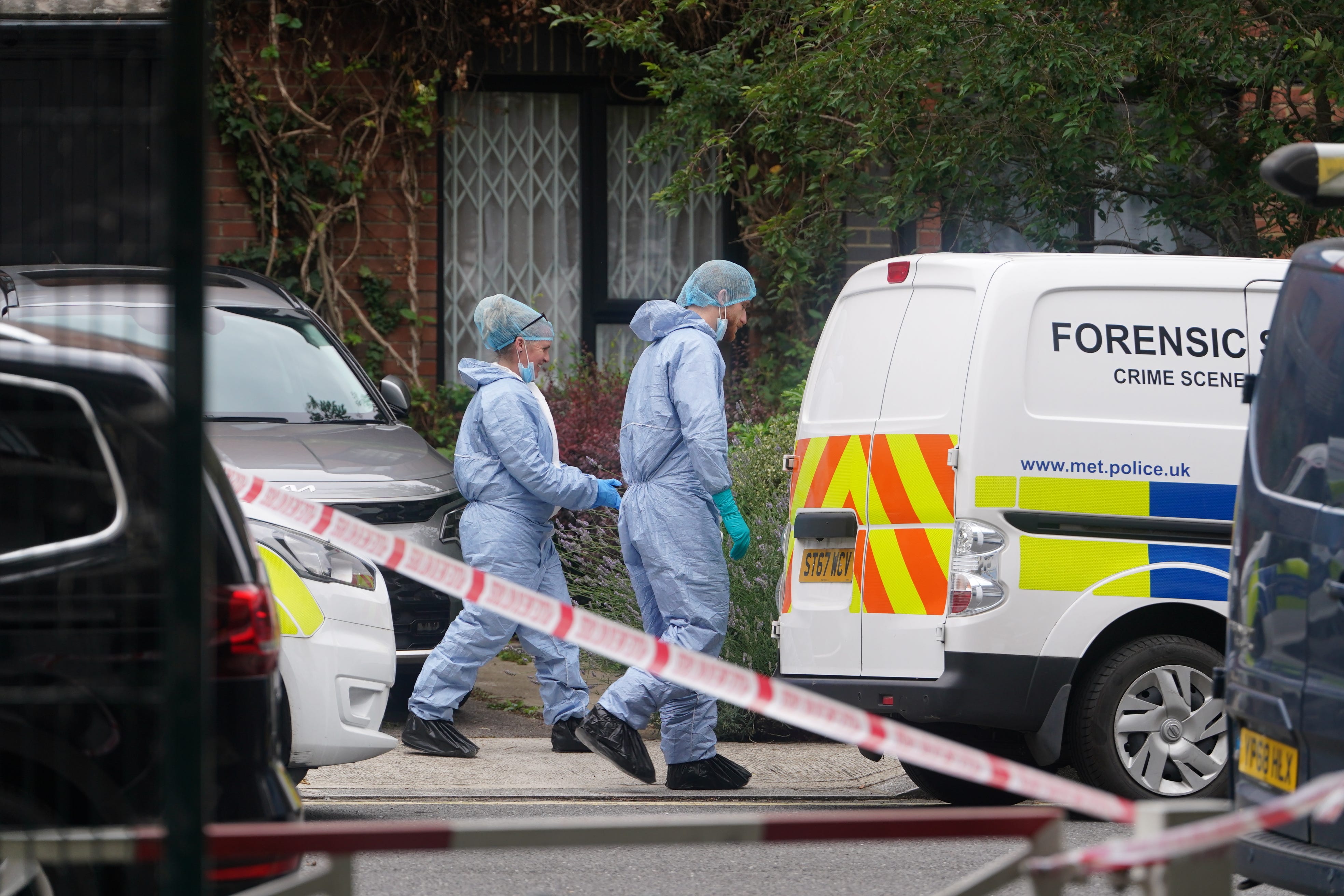 Forensic officers at an address in Shepherd’s Bush, west London, after human remains were found in two suitcases near the Clifton Suspension Bridge in Bristol (Lucy North/PA)