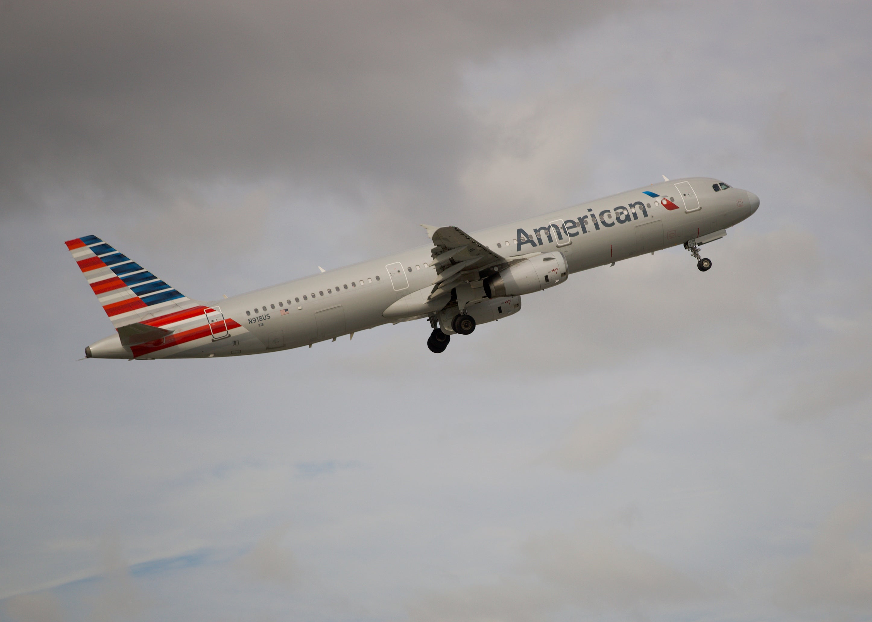 An American Airlines passenger faces federal charges after he assaulted a flight attendant, tried to open the doors and yelled he was “sane” during a flight, authorities say