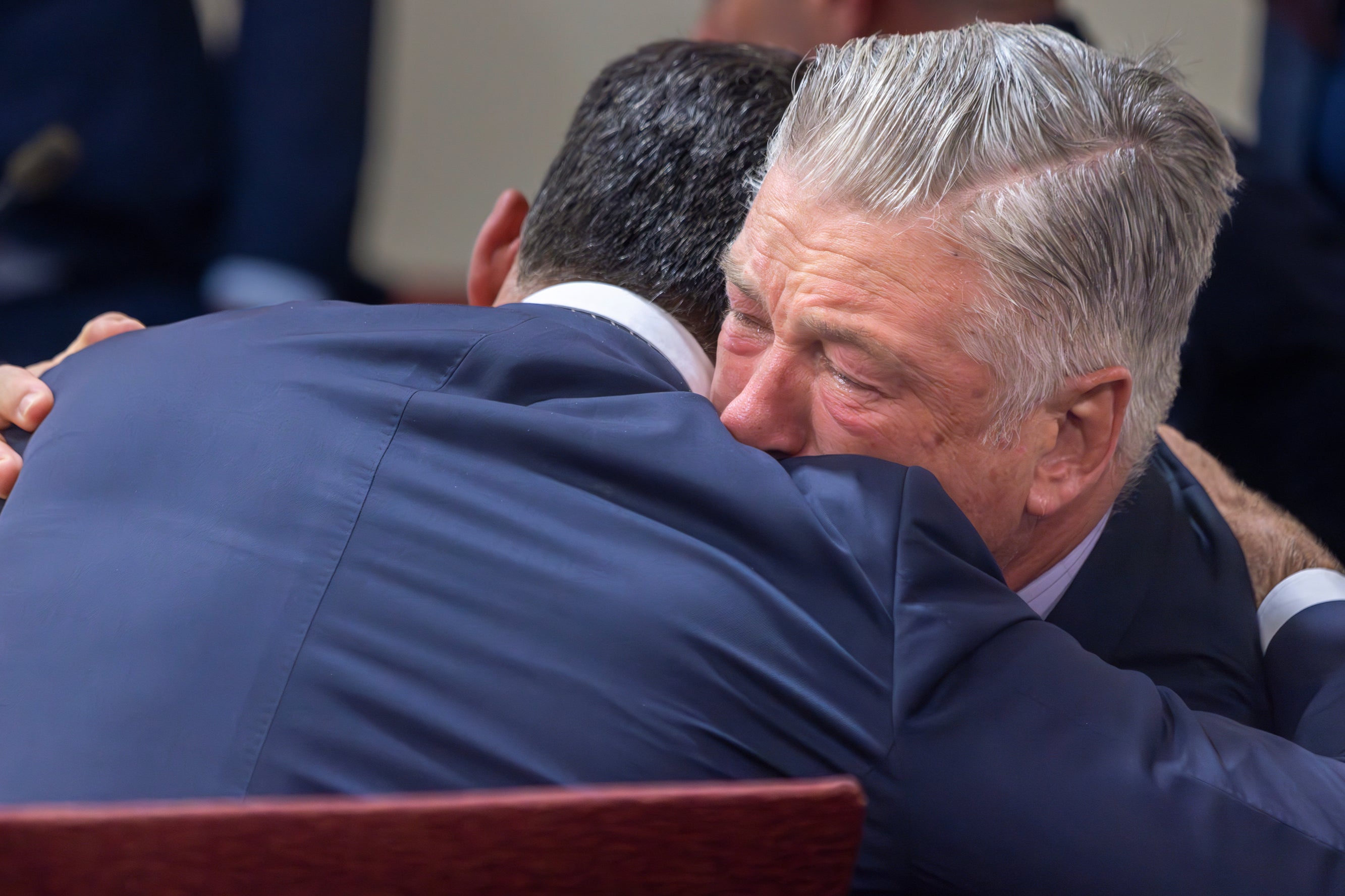 Alec Baldwin hugs his defence attorney Alex Spiro after his case is dismissed