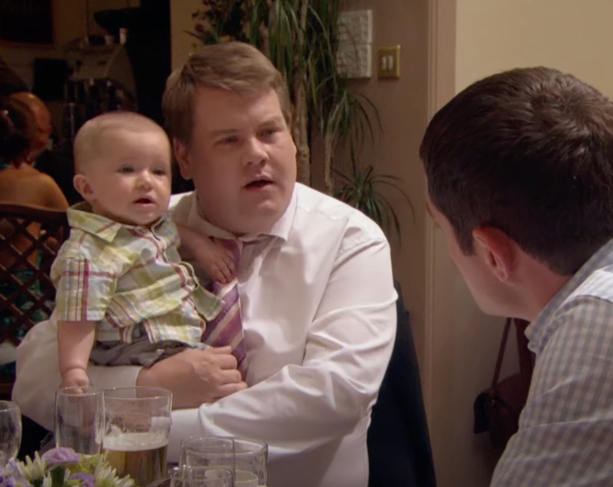 Neil the Baby with his dad Smithy, played by James Corden