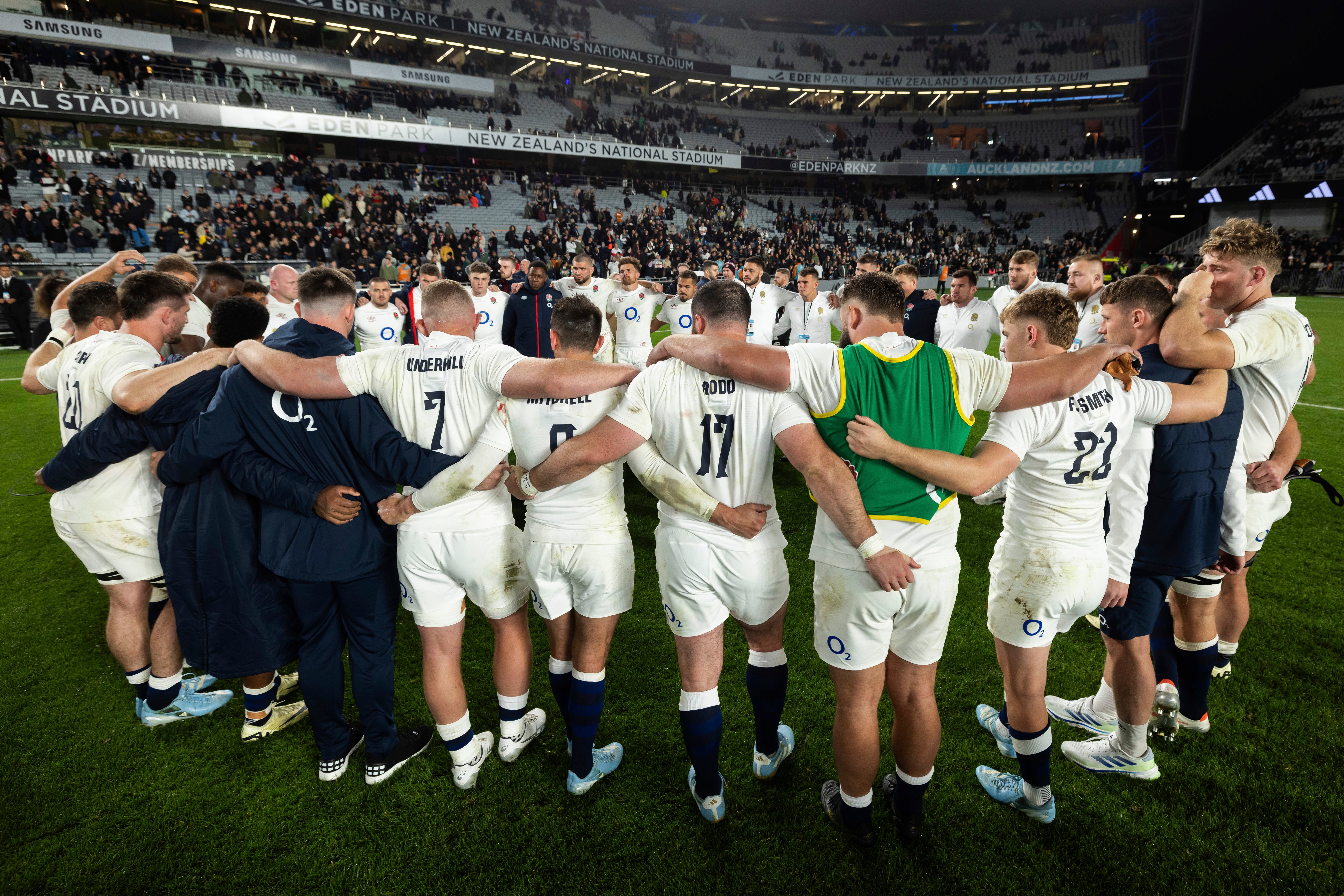 England huddle after defeat to New Zealand