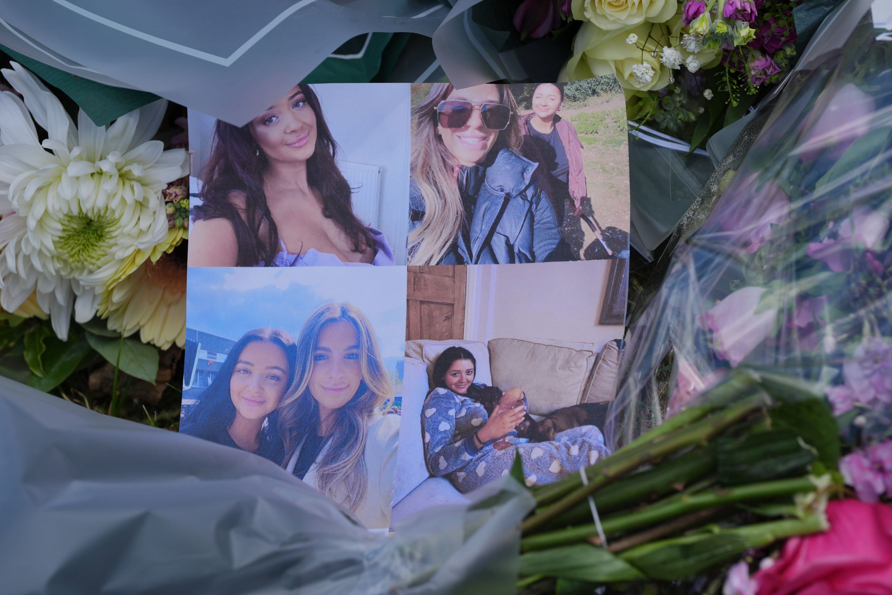 Pictures left on floral tributes at Ashlyn Close, Bushey, where the women were killed