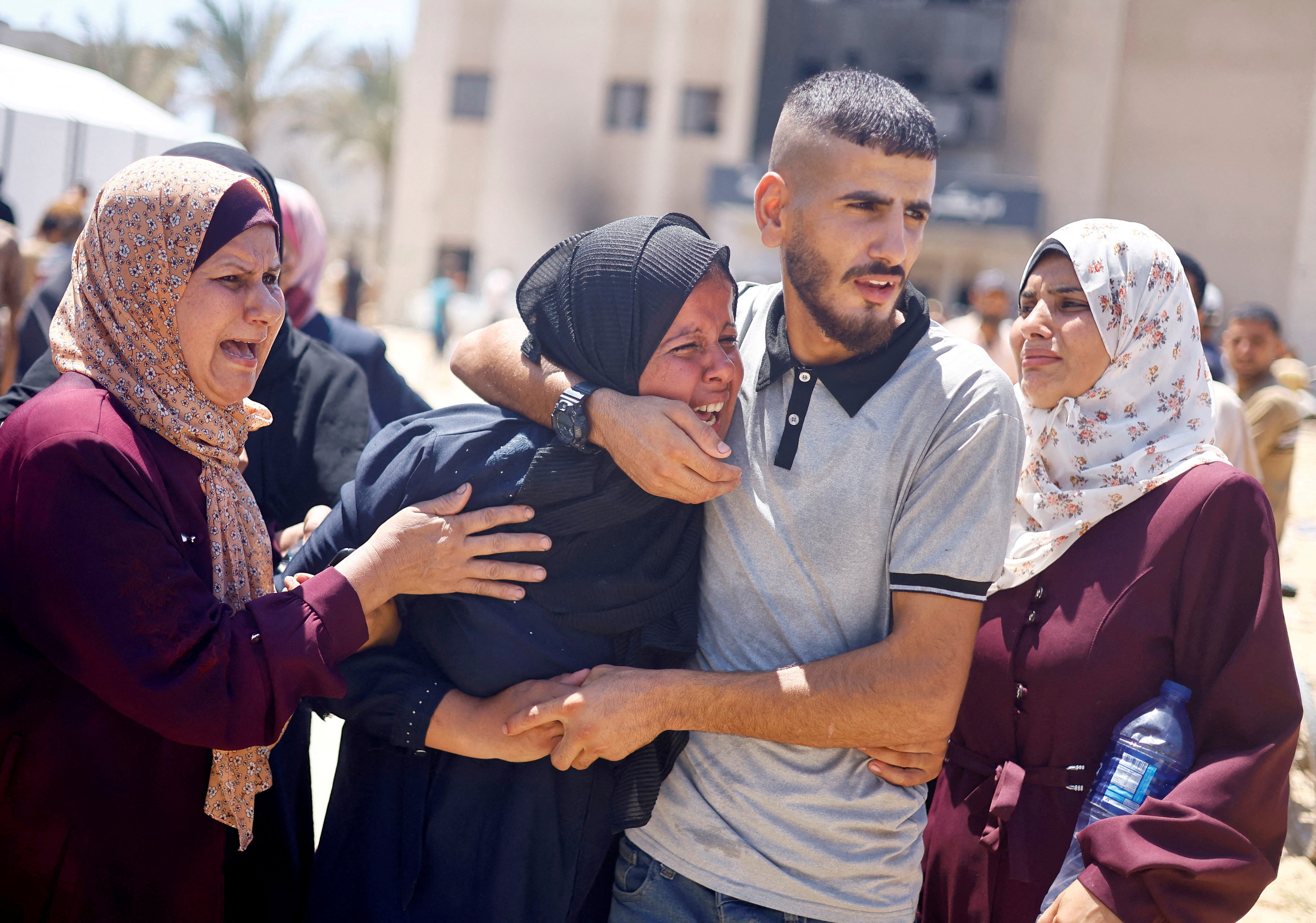 Grieving crowds gather outside Nasser Hospital after the Israeli attack