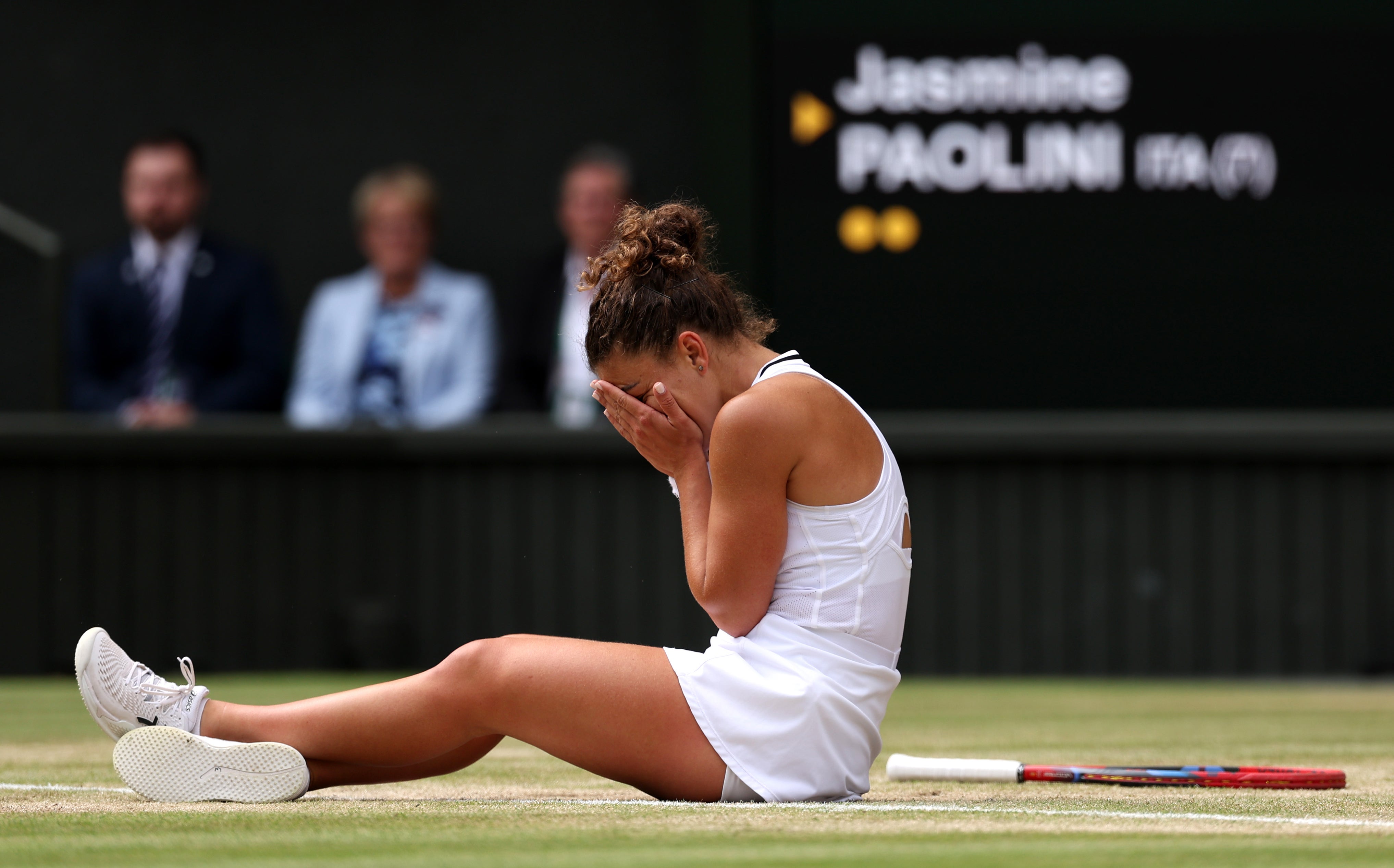 Paolini slumps to the floor after losing a point in a riveting final