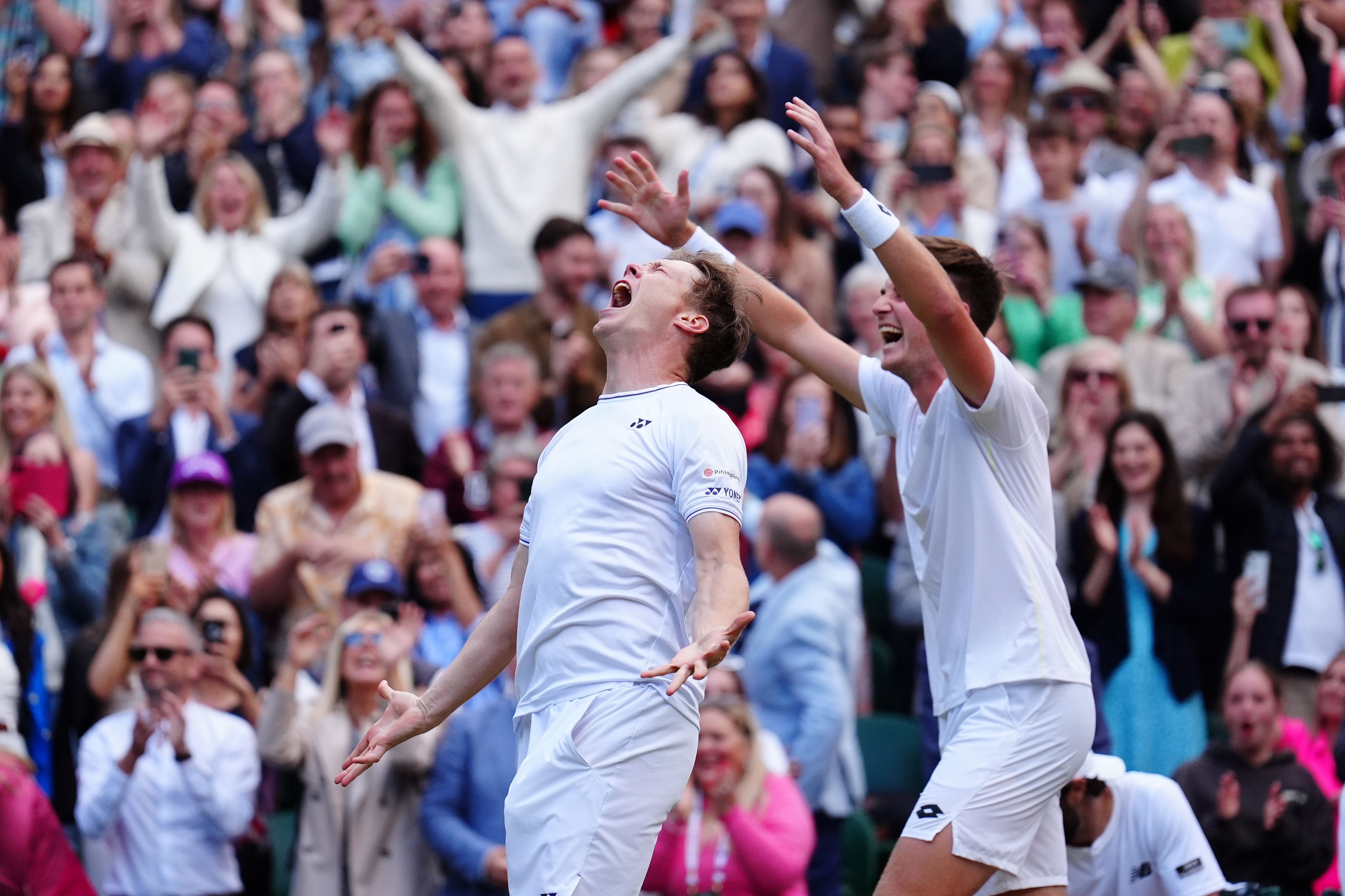 Henry Patten (right) and Harri Heliovaara celebrate their victory (Mike Egerton/PA)