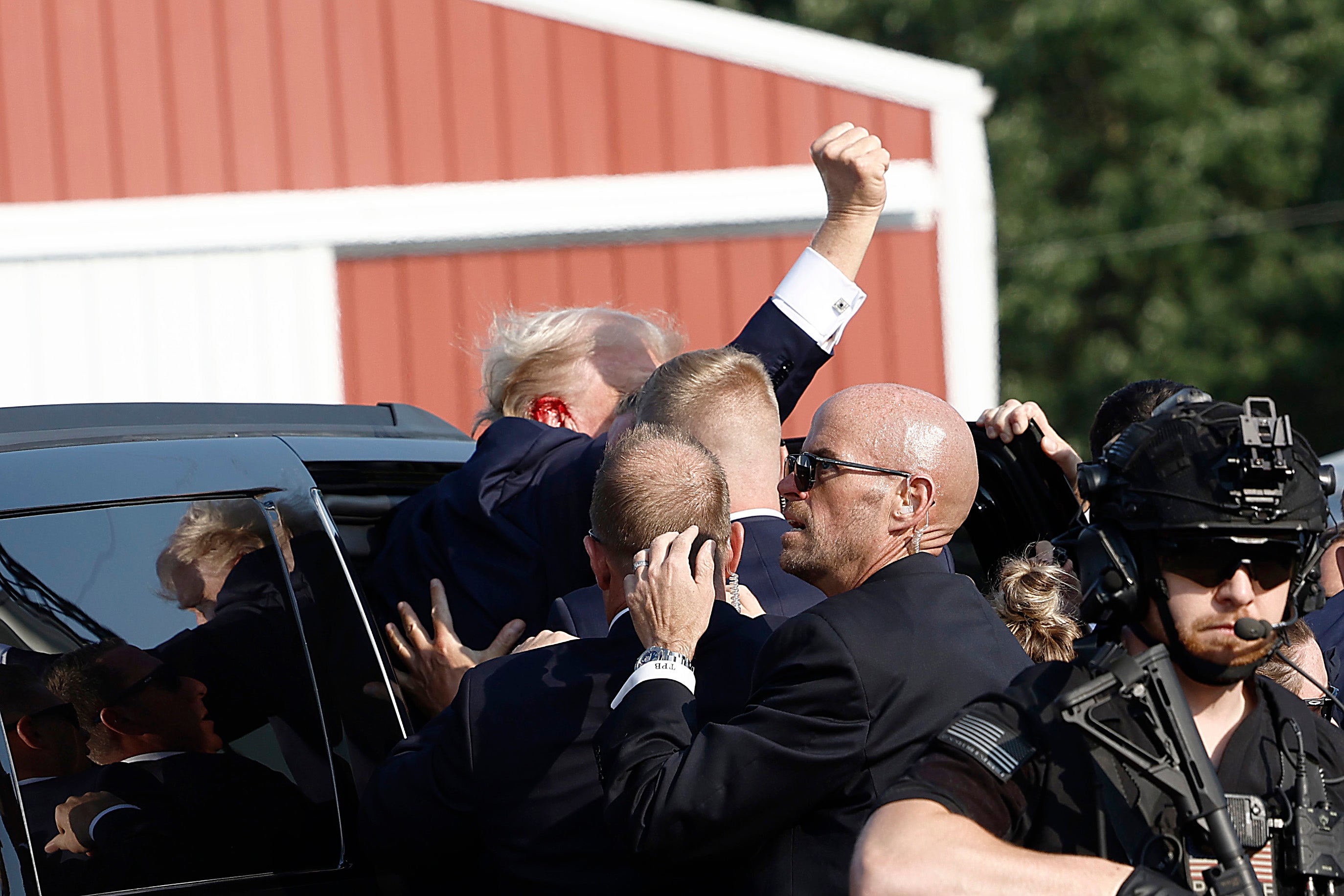 Trump was rushed to his motorcade which promptly left the scene with lights and sirens blaring