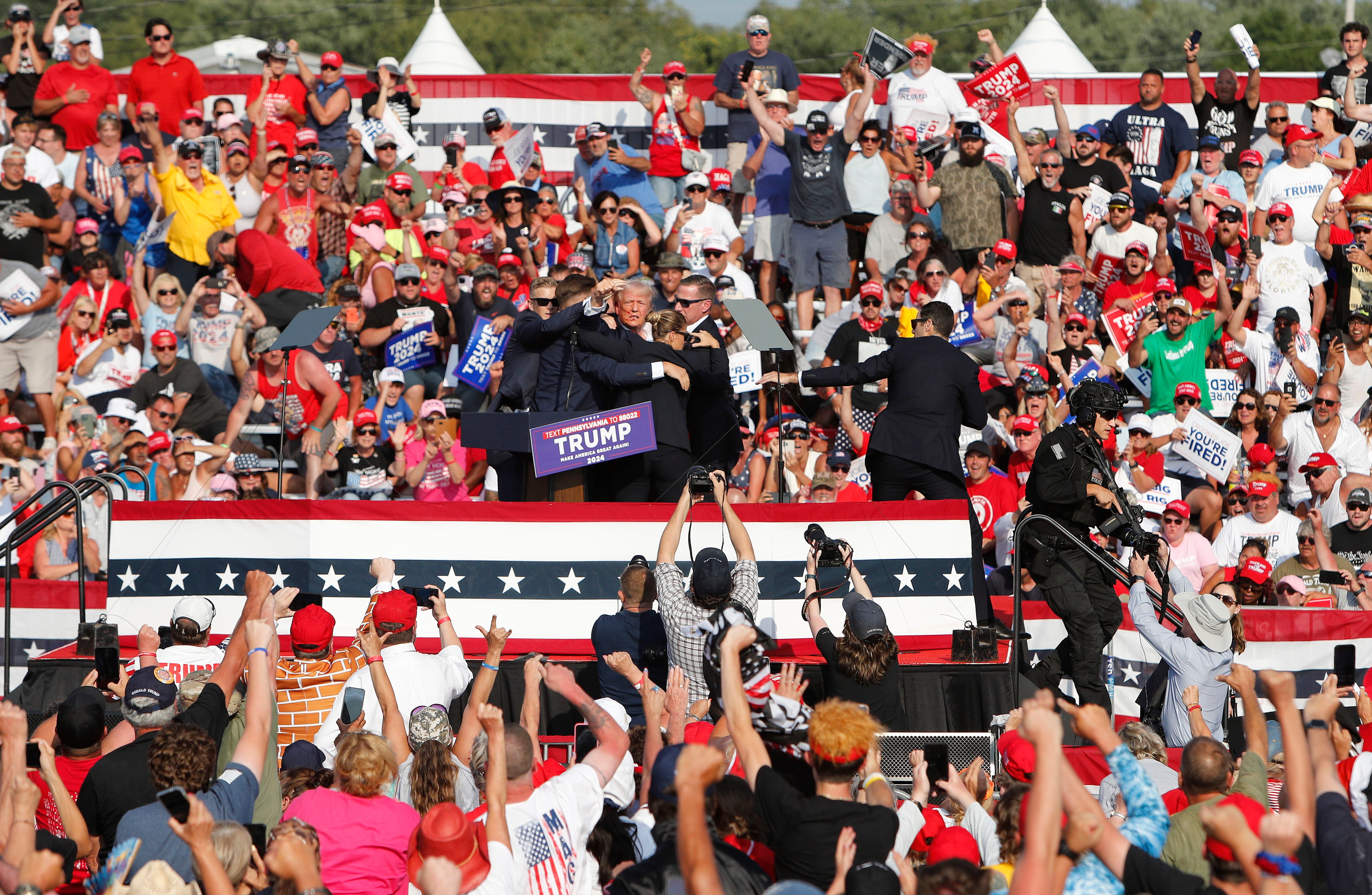 Donald Trump is rushed off stage by Secret Service following gunshots as his rally in Butler, Pennsylvania on Saturday, July 13. Trump was shot and injured but survived