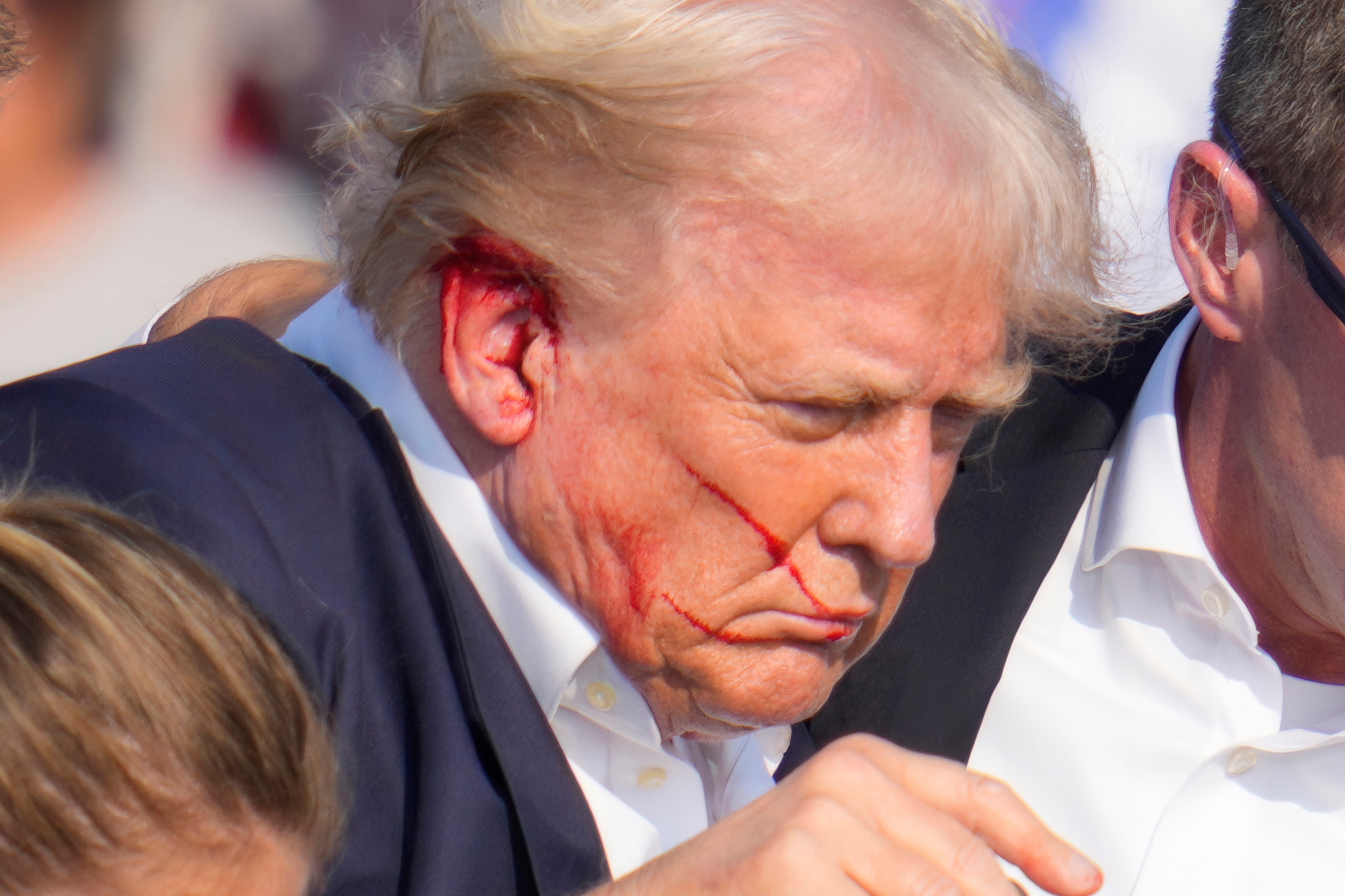 Pictures showed blood on Donald Trump’s right ear and part of his face after shots were fired during the rally (Gene J Puskar/AP)