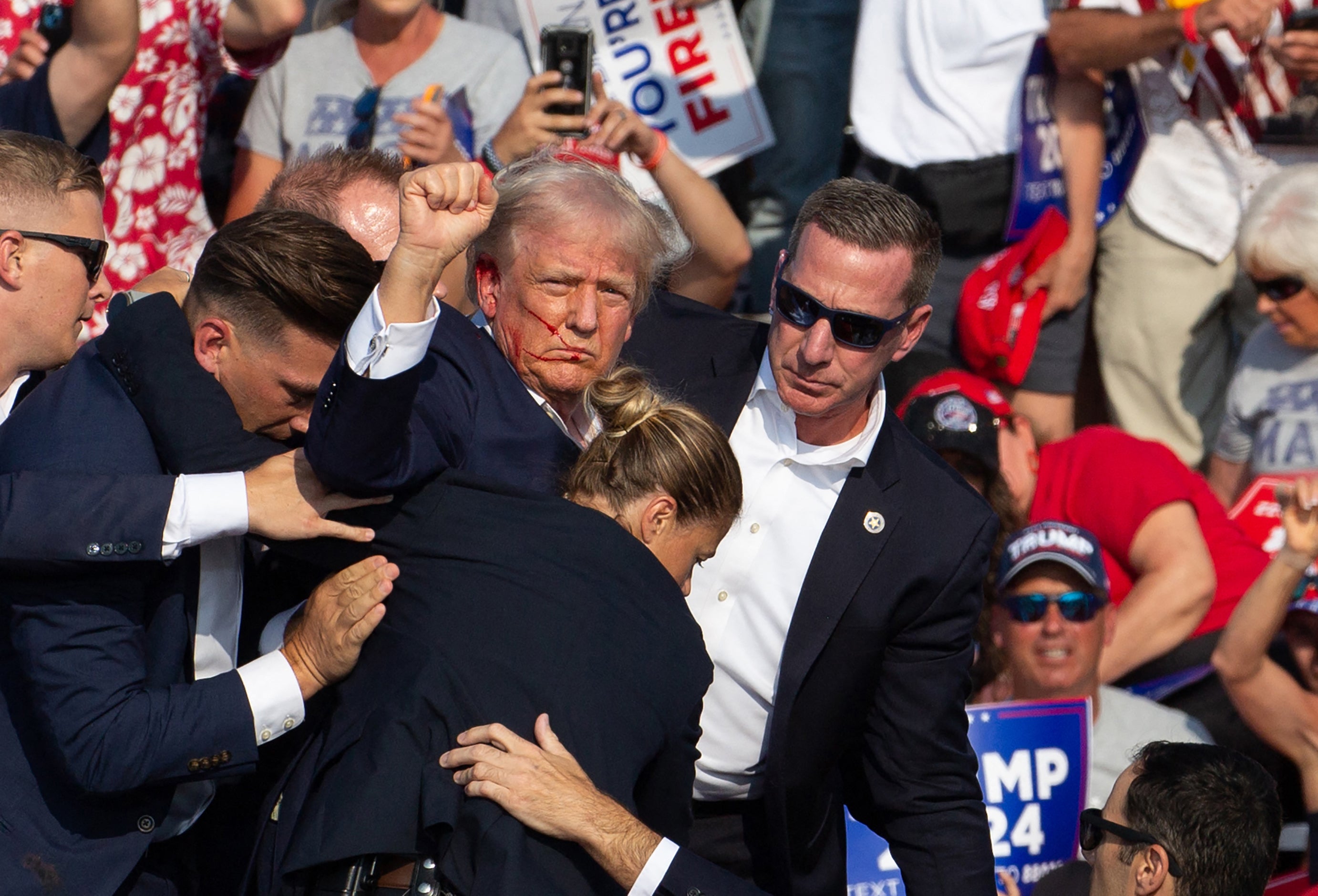 Republican candidate Donald Trump shortly after being shot in the ear during a rally on Thursday