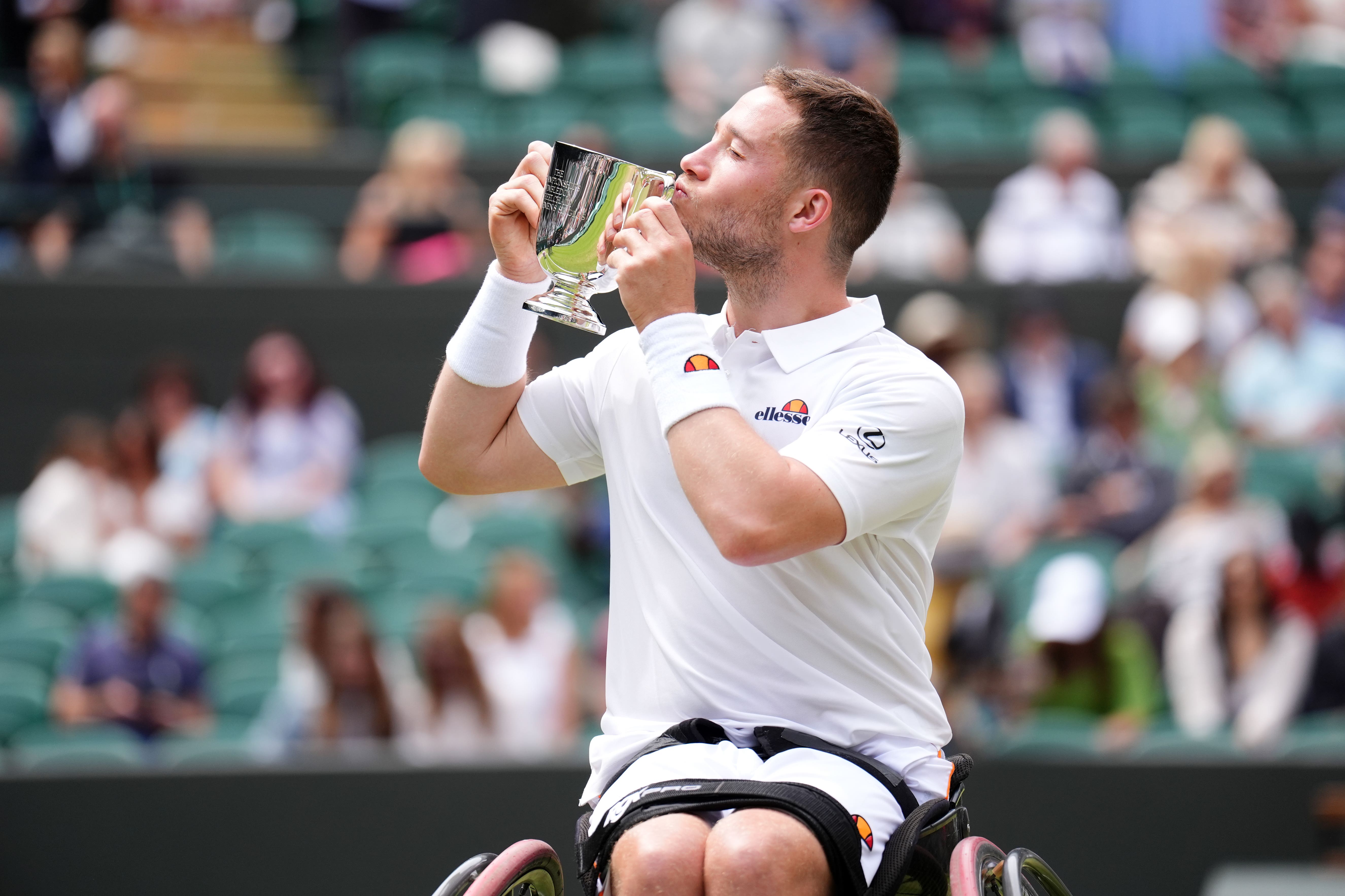 Alfie Hewett kisses the trophy (John Walton/PA)