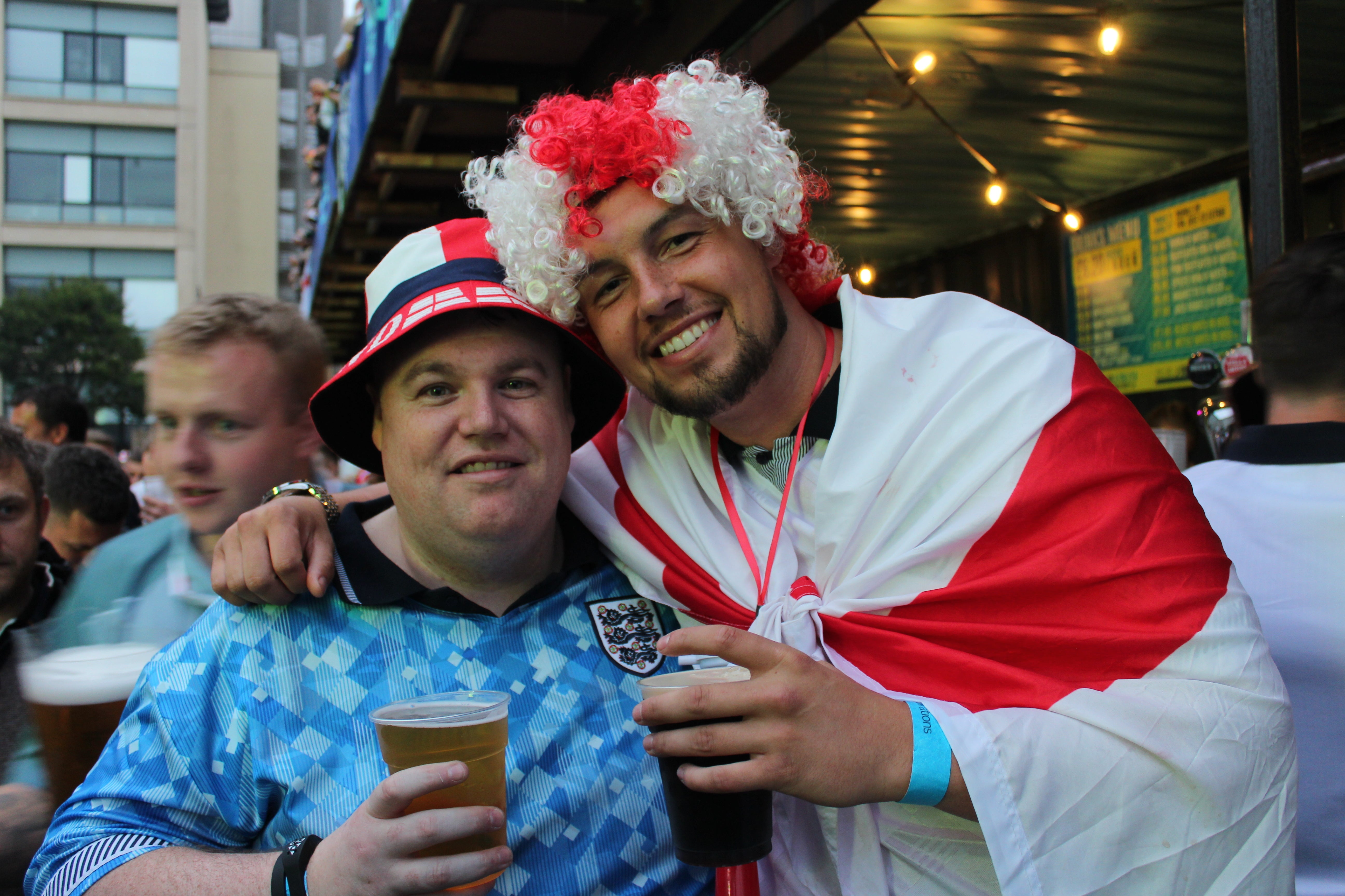 England fans clutch another round of beers just moment before Spain scored in the Euro Final at the start of the second half