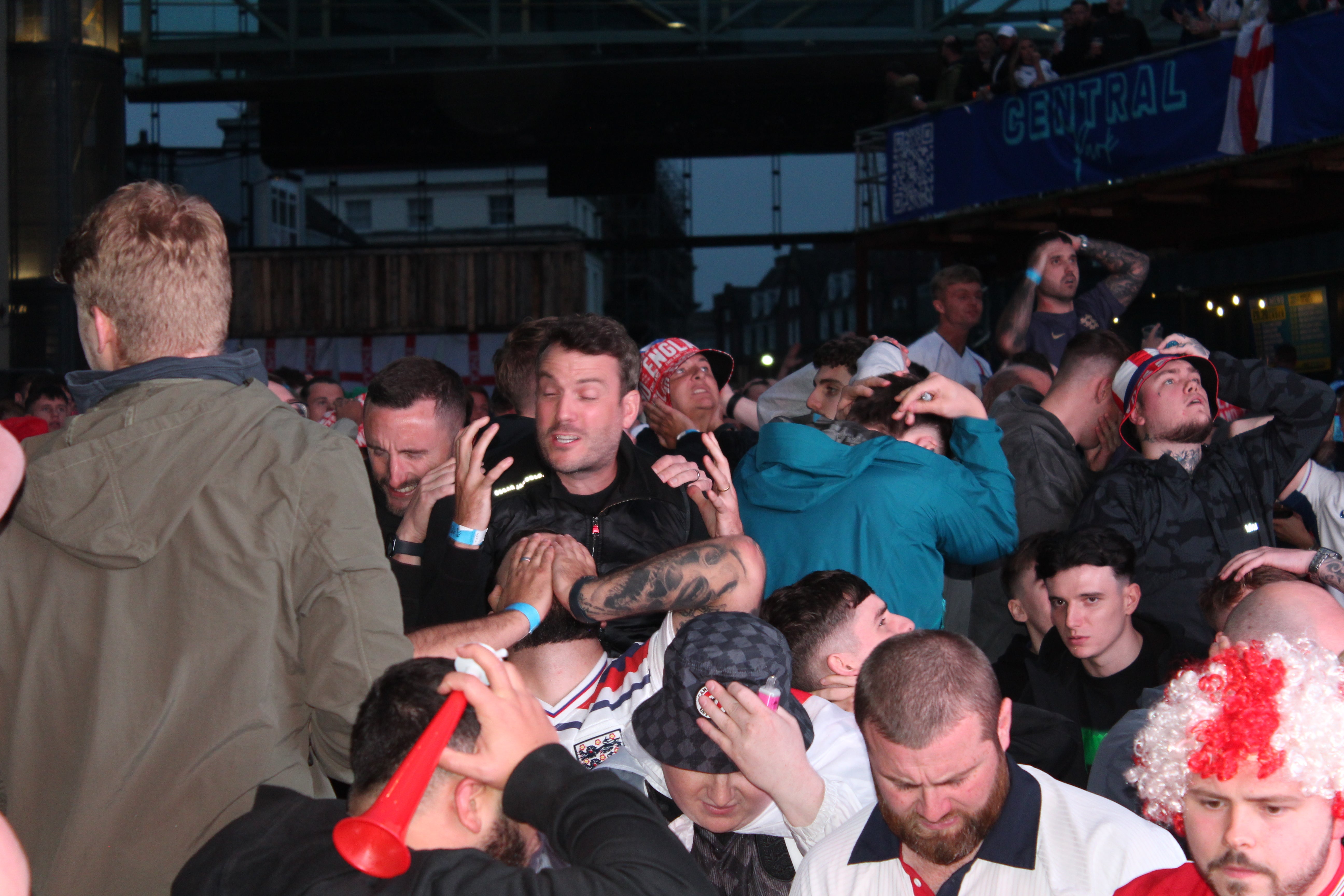 England fans hold their heads in their hands as they realise it’s all over