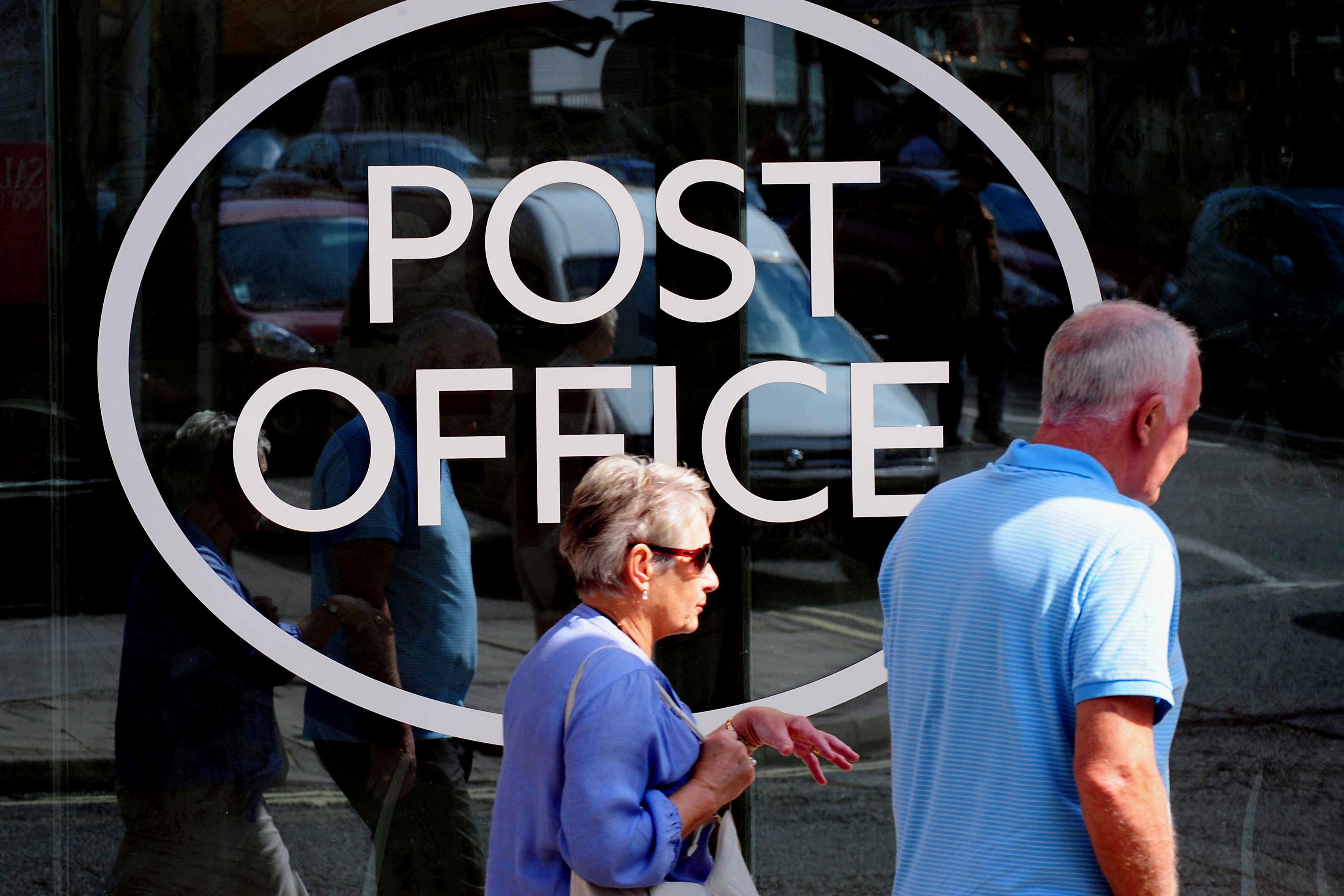 The Post Office has an agreement with many banks, allowing customers to make everyday transactions over its counters (PA)