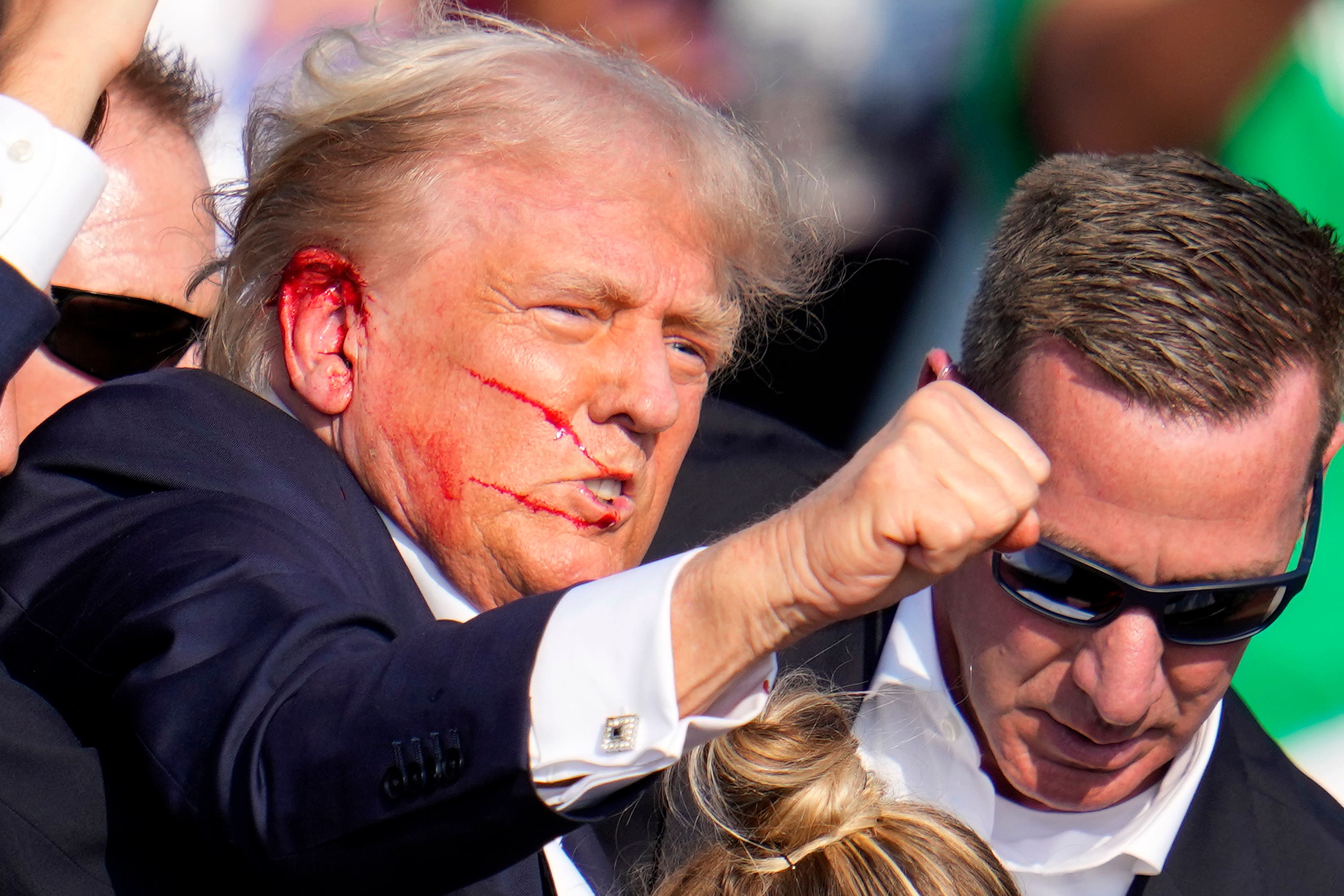 Former president Donald Trump reacts following an assassination attempt at a campaign event in Butler