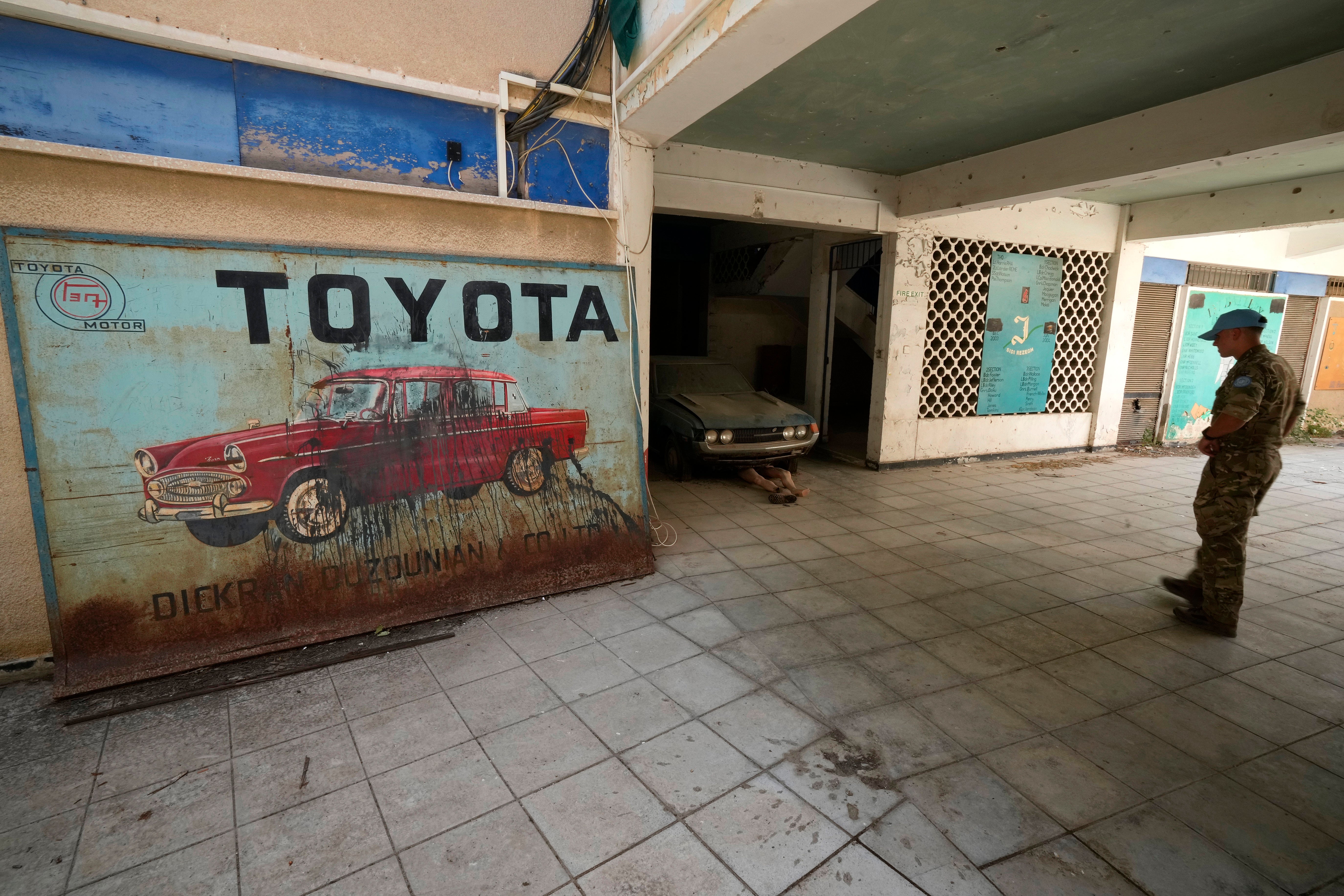 A U.N. Peacekeeper stands at Nicosia’s Toyota show room inside the U.N. controlled buffer zone